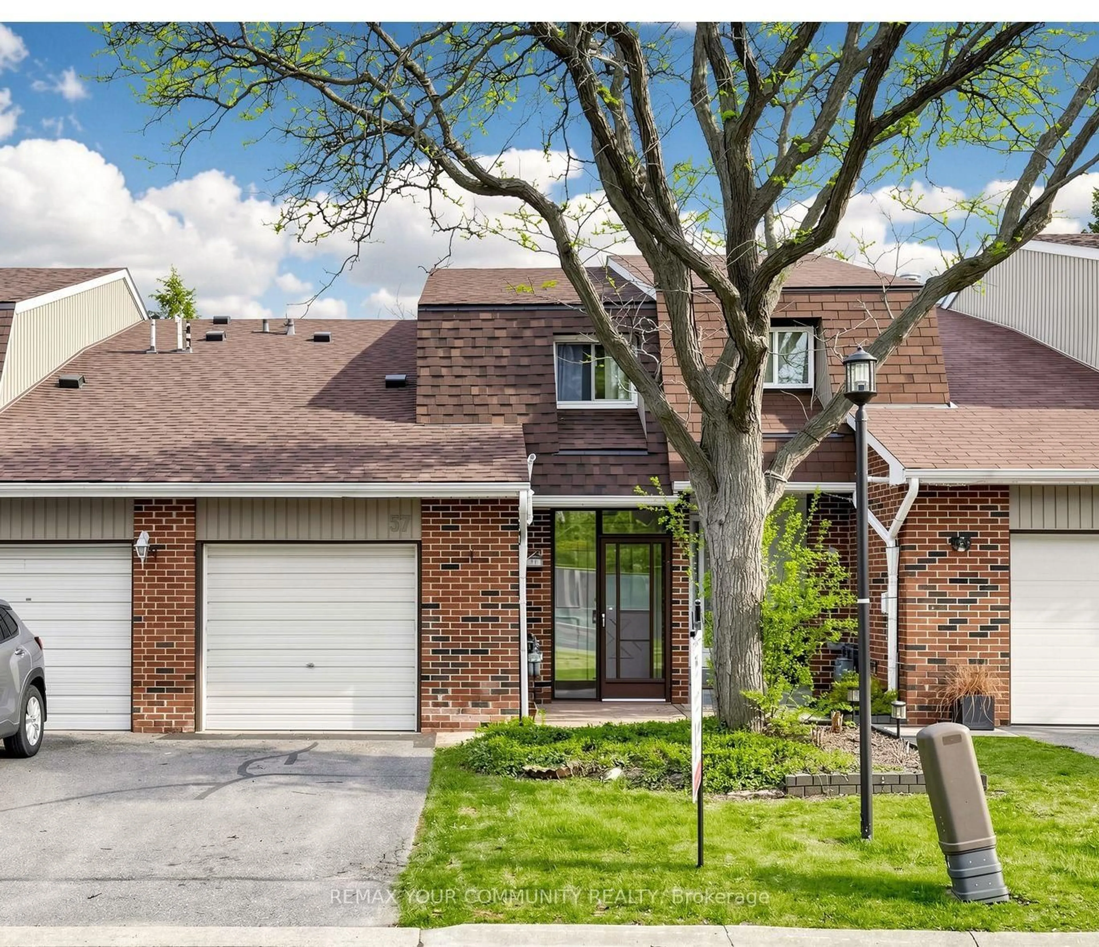 Home with brick exterior material, street for 57 Kindale Way #32, Markham Ontario L3T 4Z2