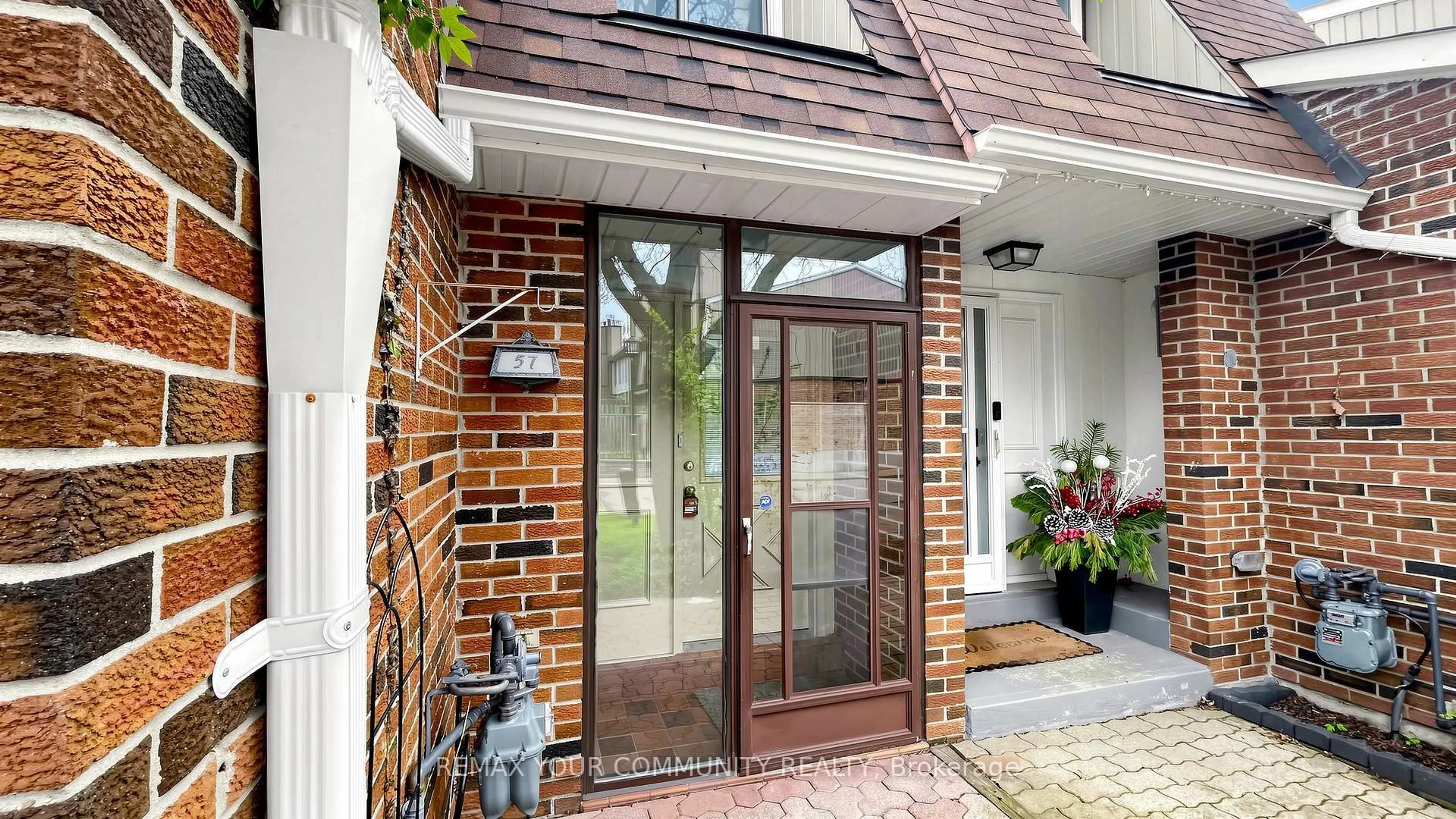Home with brick exterior material, street for 57 Kindale Way #32, Markham Ontario L3T 4Z2