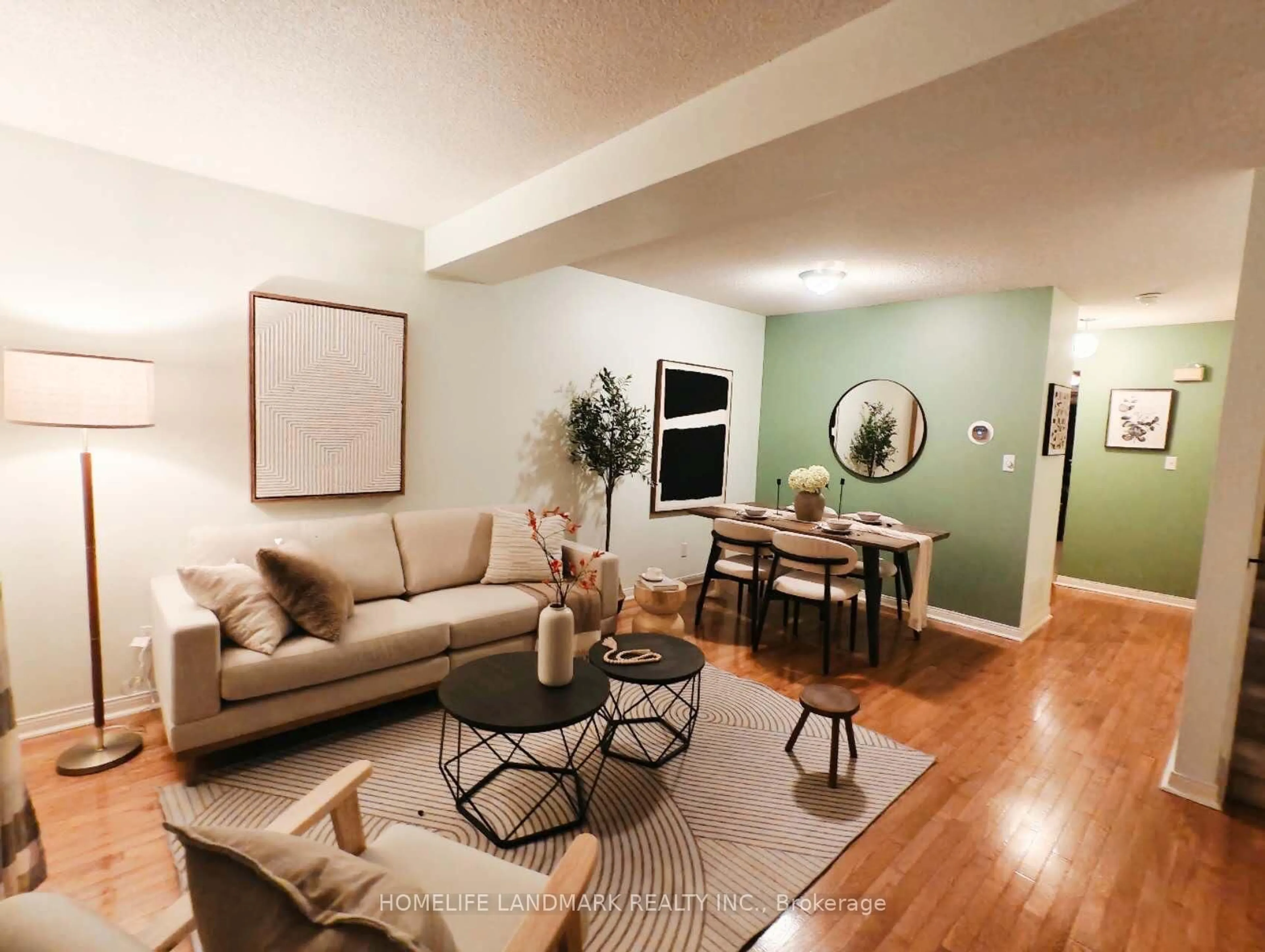 Living room with furniture, wood/laminate floor for 119 William Curtis Circ #57, Newmarket Ontario L3Y 8L8
