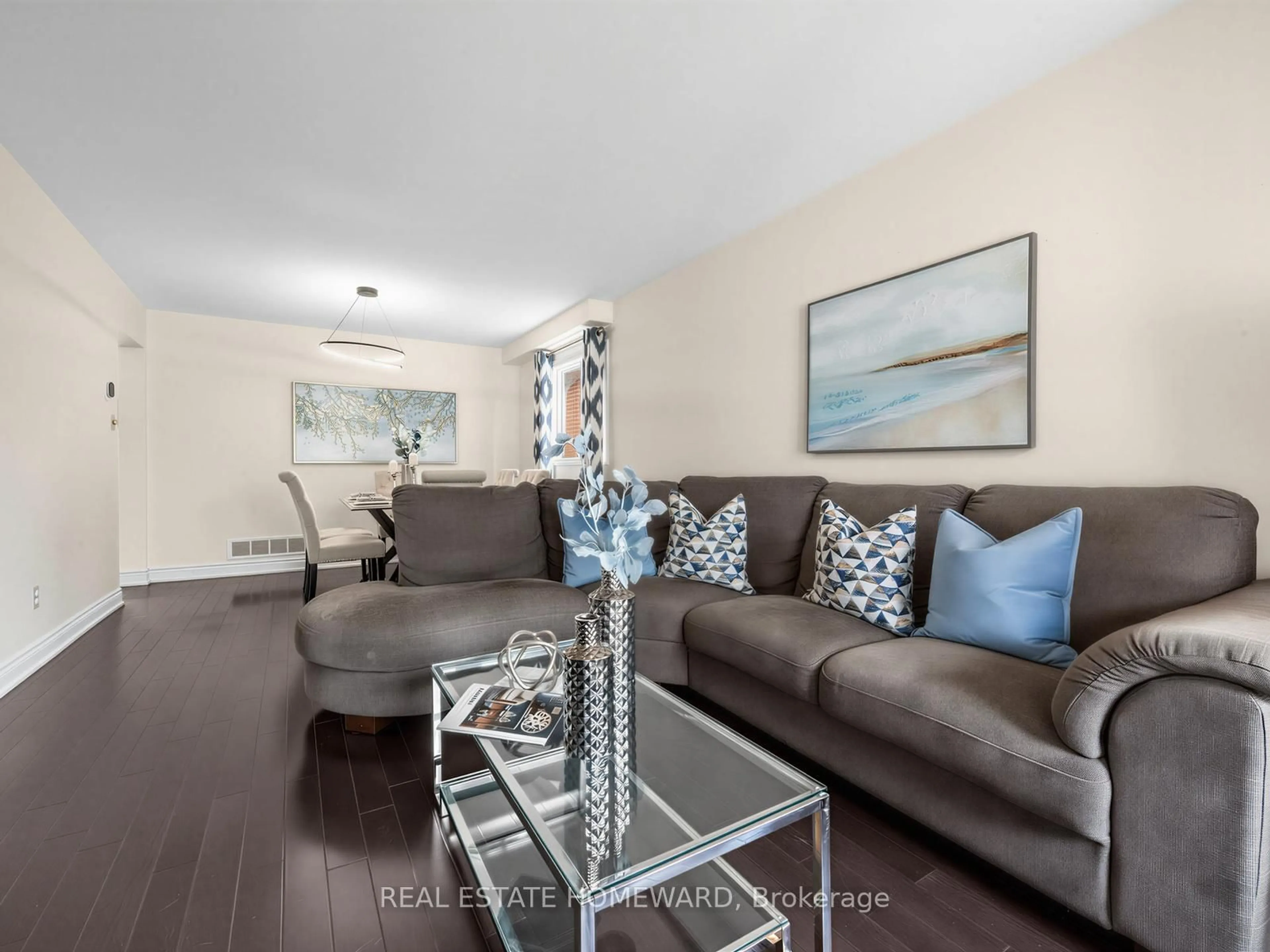 Living room with furniture, wood/laminate floor for 77 Bendamere Cres, Markham Ontario L3P 6Y1
