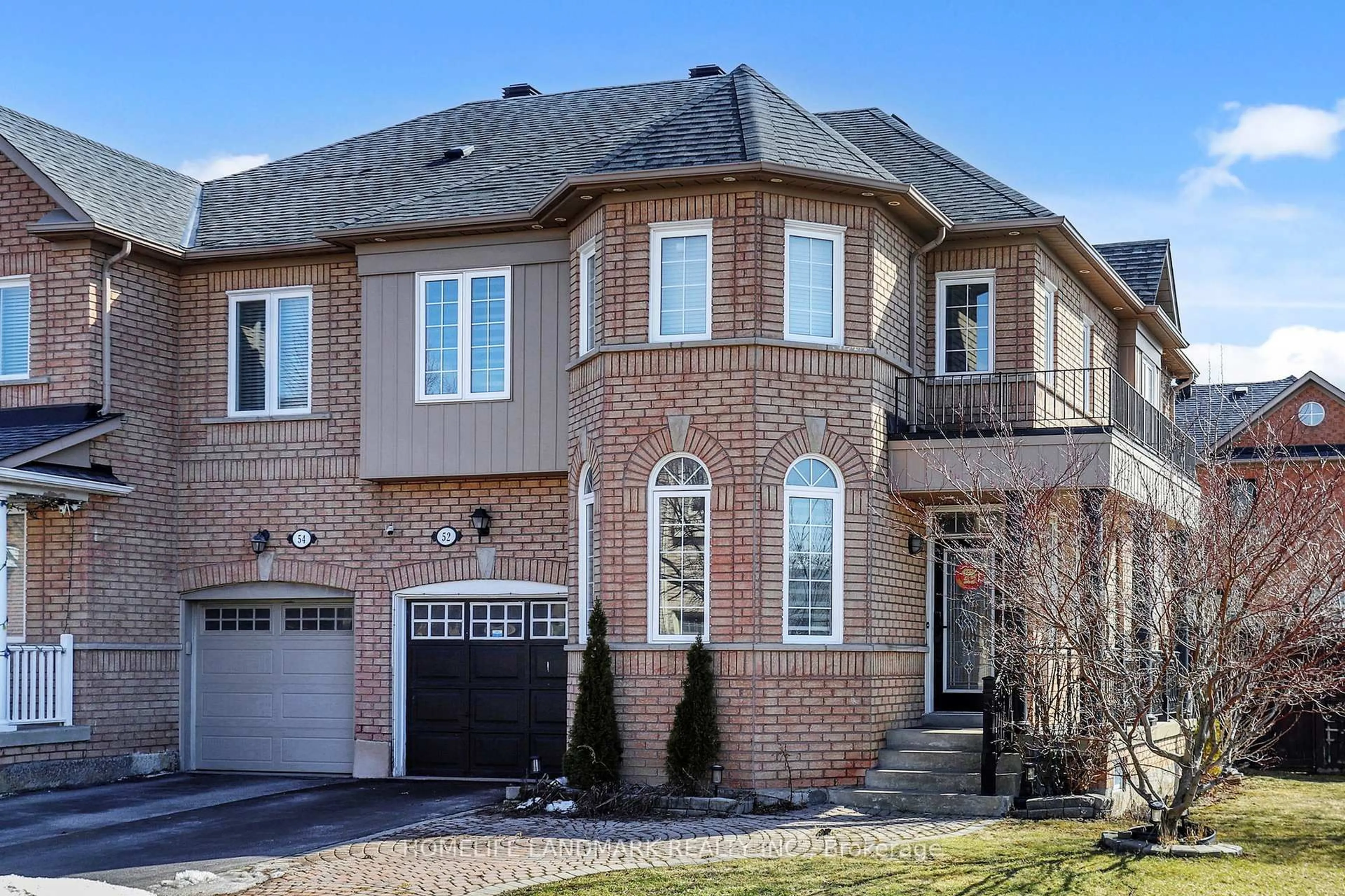Home with brick exterior material, street for 52 Lakespring Dr, Markham Ontario L6C 2Z1
