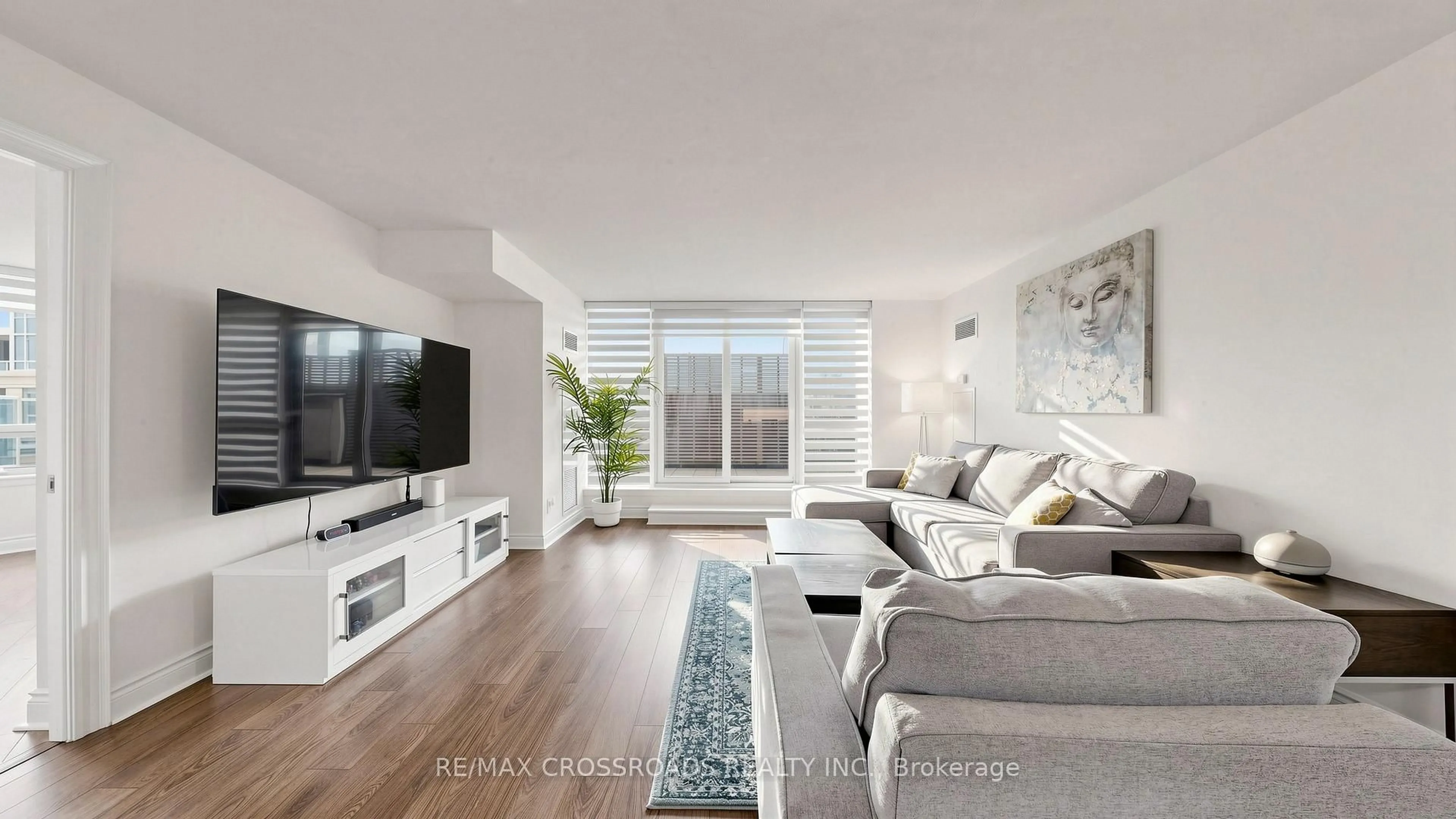 Living room with furniture, wood/laminate floor for 23 Cox Blvd #656, Markham Ontario L3R 4G1