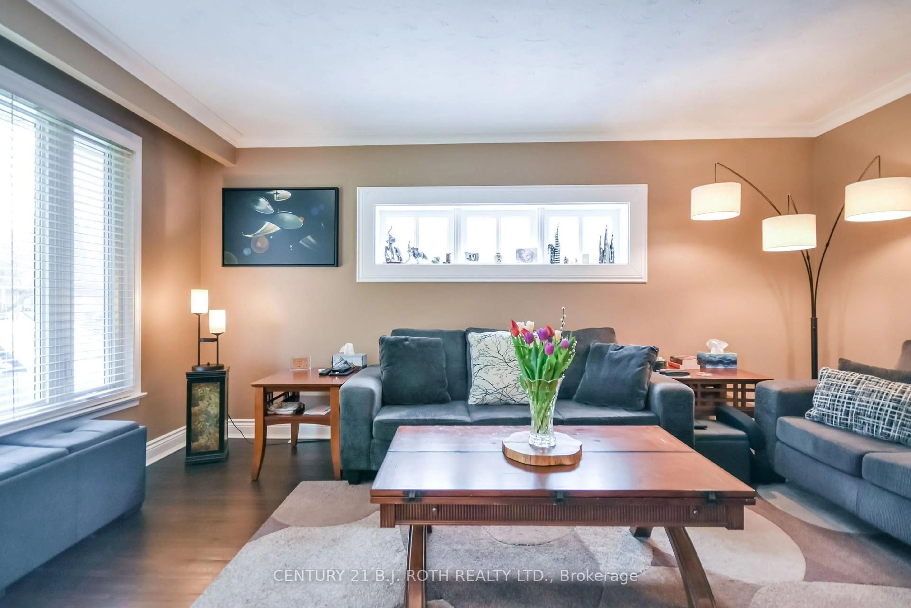 Living room with furniture, wood/laminate floor for 128 Cherrywood Dr, Newmarket Ontario L3Y 2X7