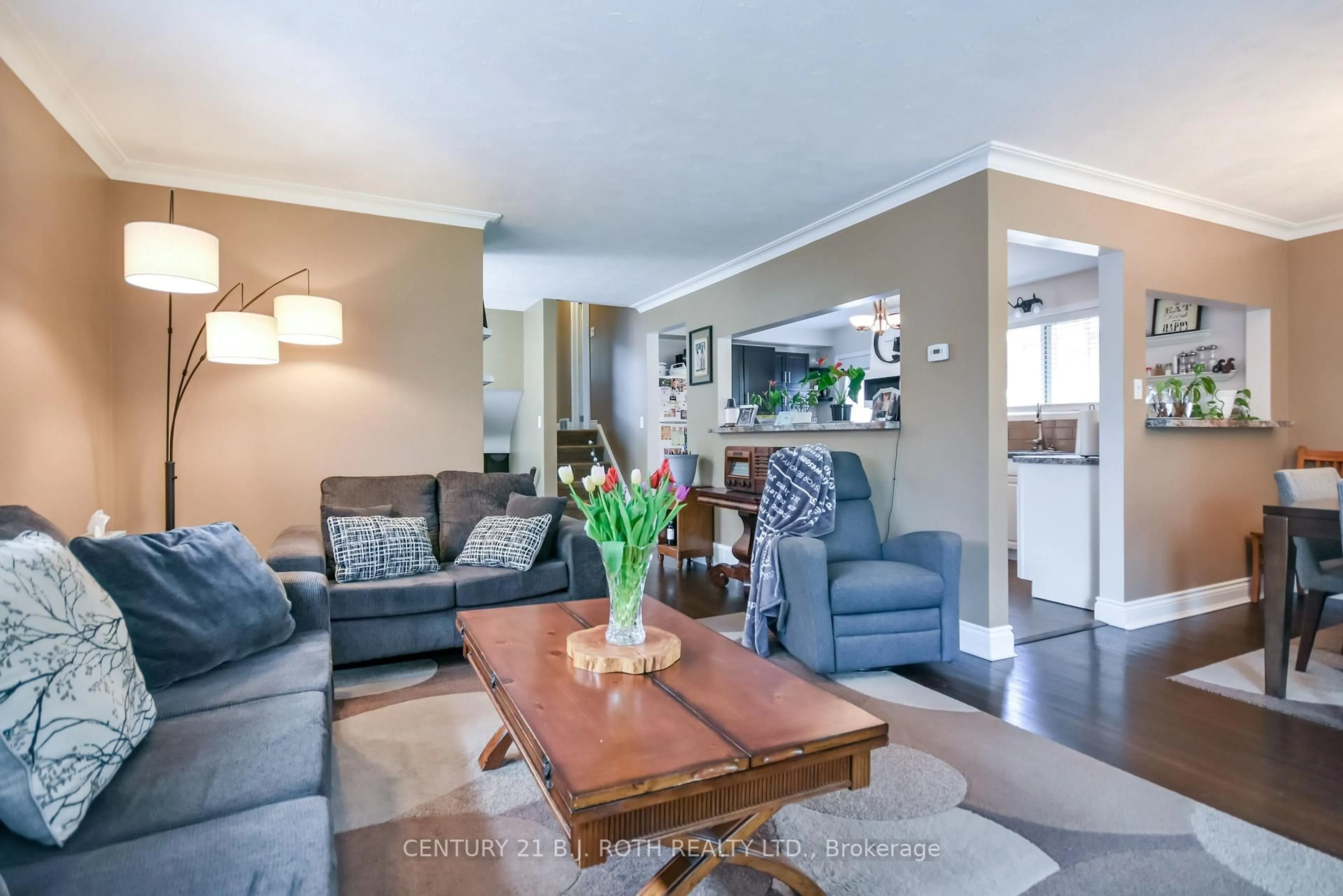 Living room with furniture, wood/laminate floor for 128 Cherrywood Dr, Newmarket Ontario L3Y 2X7