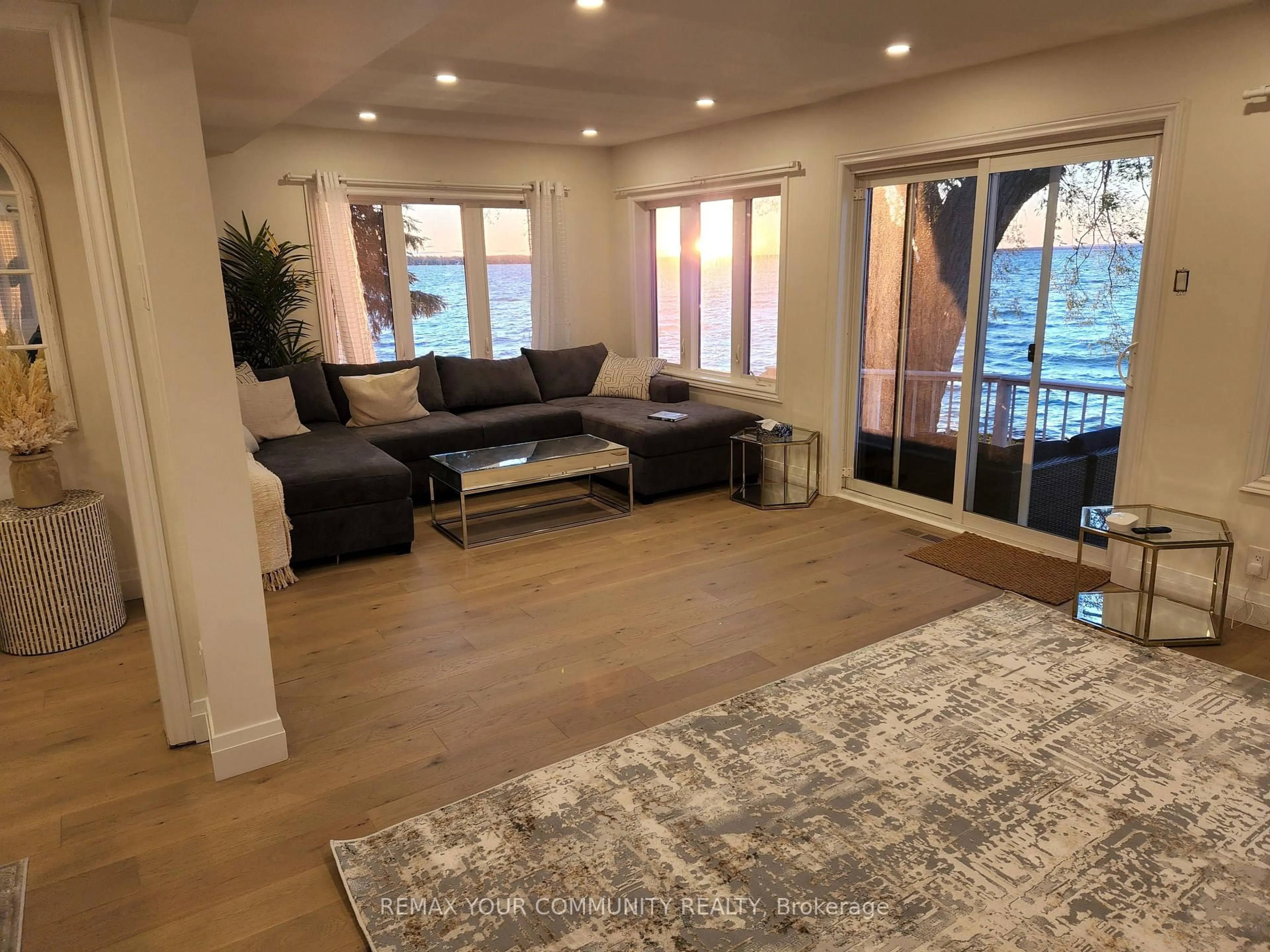 Living room with furniture, wood/laminate floor for 228 Lake Dr, Georgina Ontario L4P 3E9