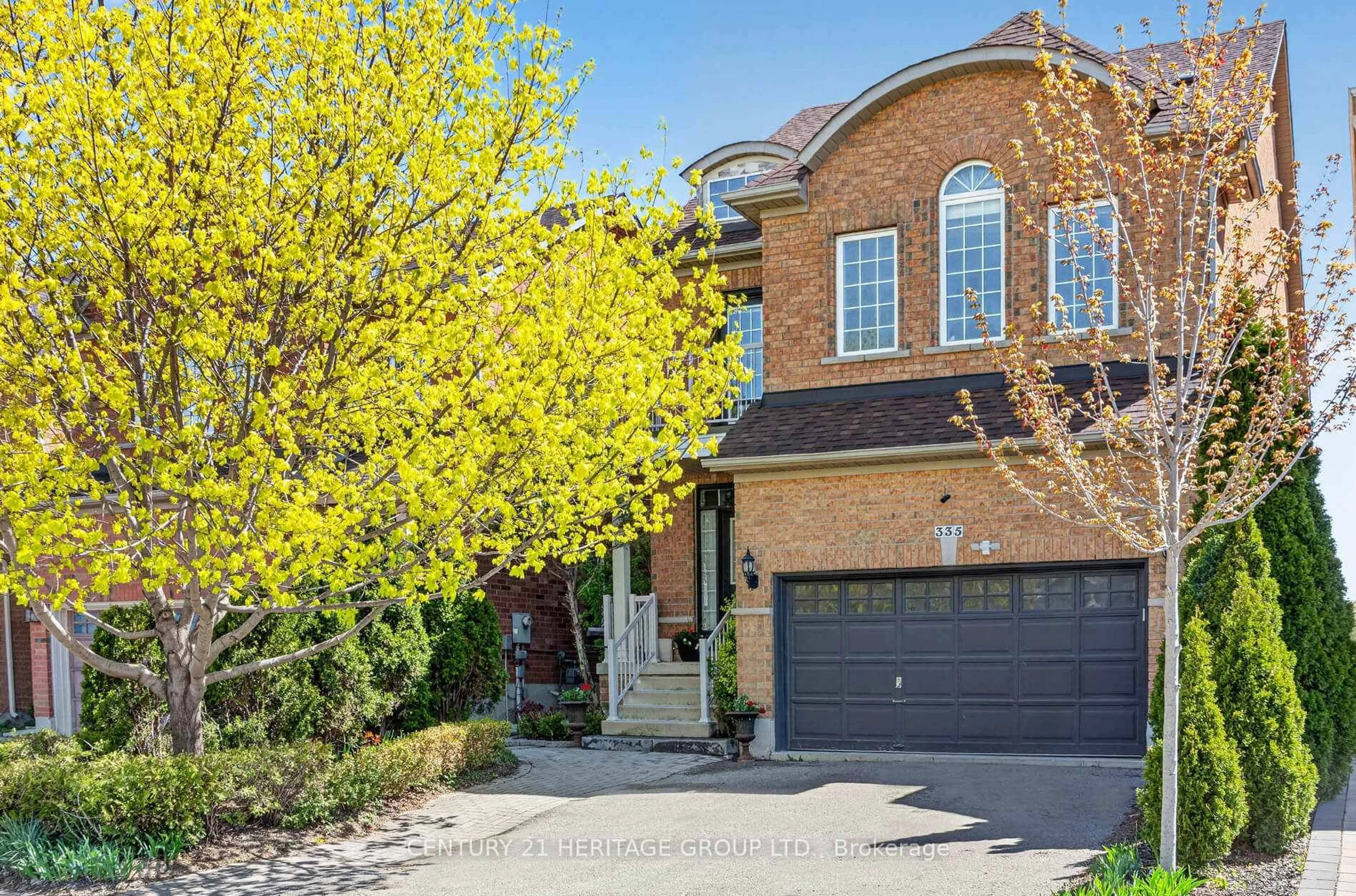 Home with brick exterior material, street for 335 Bathurst Glen Dr, Vaughan Ontario L4J 9A3