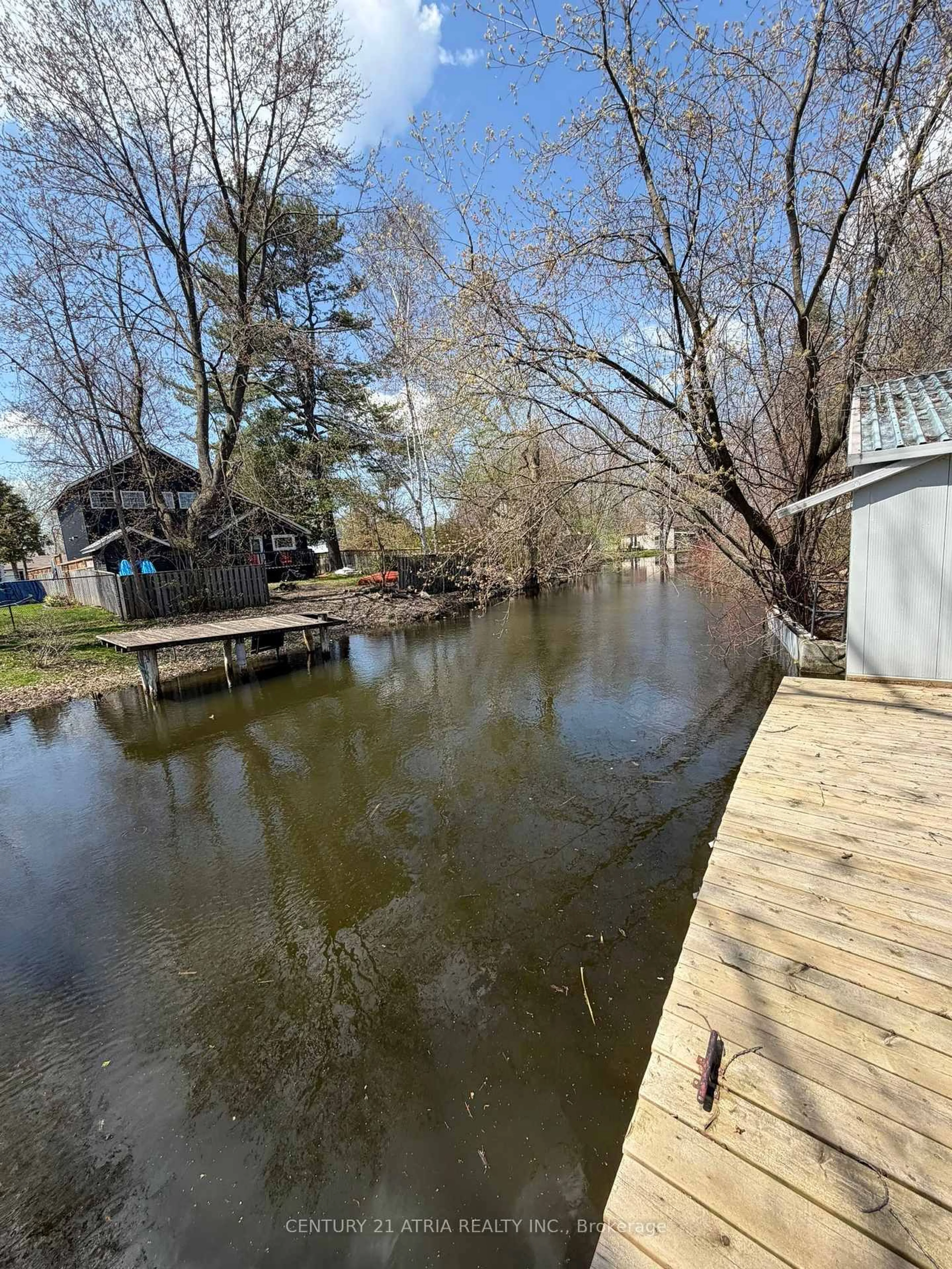 A pic from outside/outdoor area/front of a property/back of a property/a pic from drone, water/lake/river/ocean view for 27 Waterbend Dr, Georgina Ontario L4P 2S3