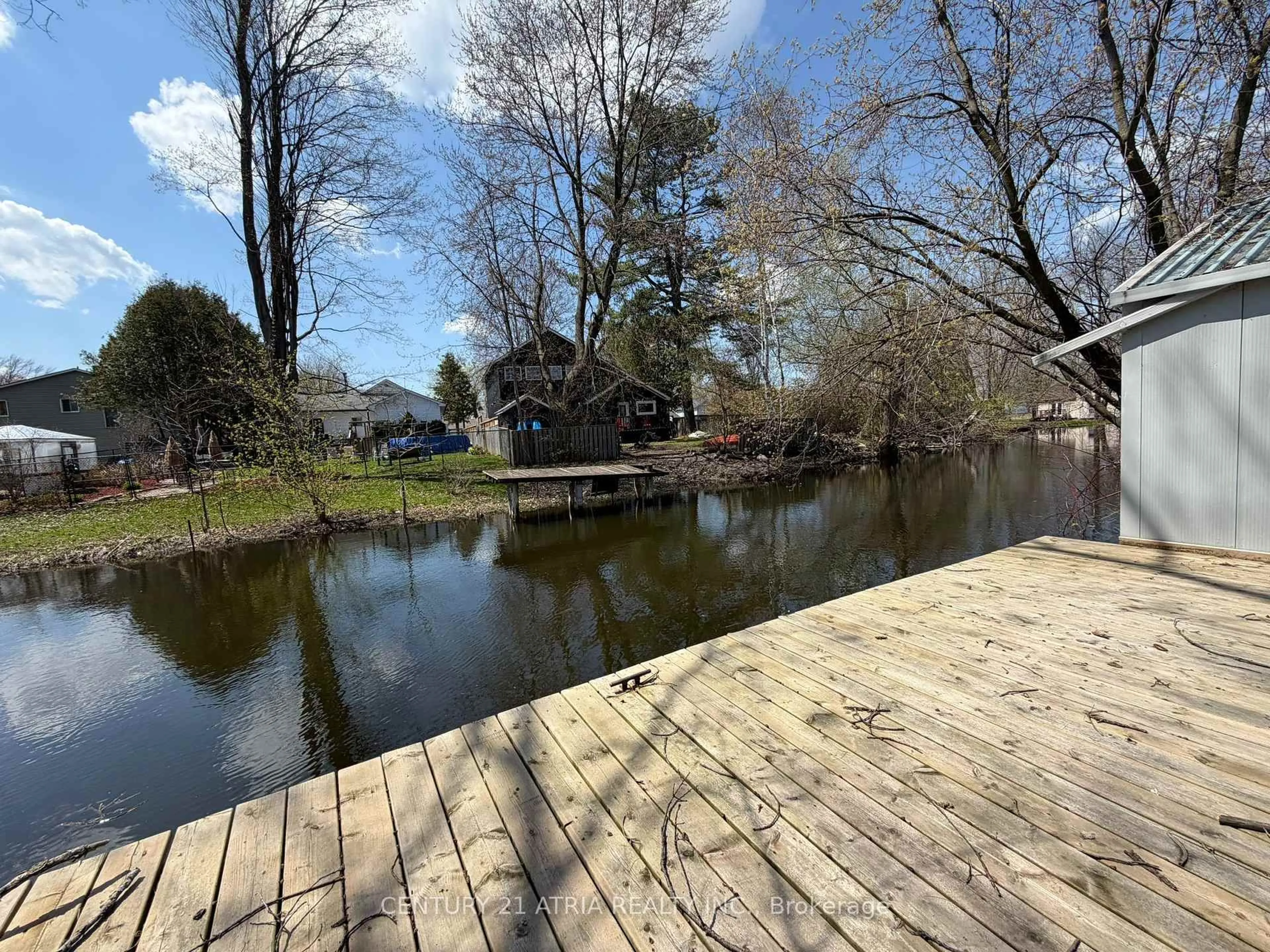 A pic from outside/outdoor area/front of a property/back of a property/a pic from drone, water/lake/river/ocean view for 27 Waterbend Dr, Georgina Ontario L4P 2S3
