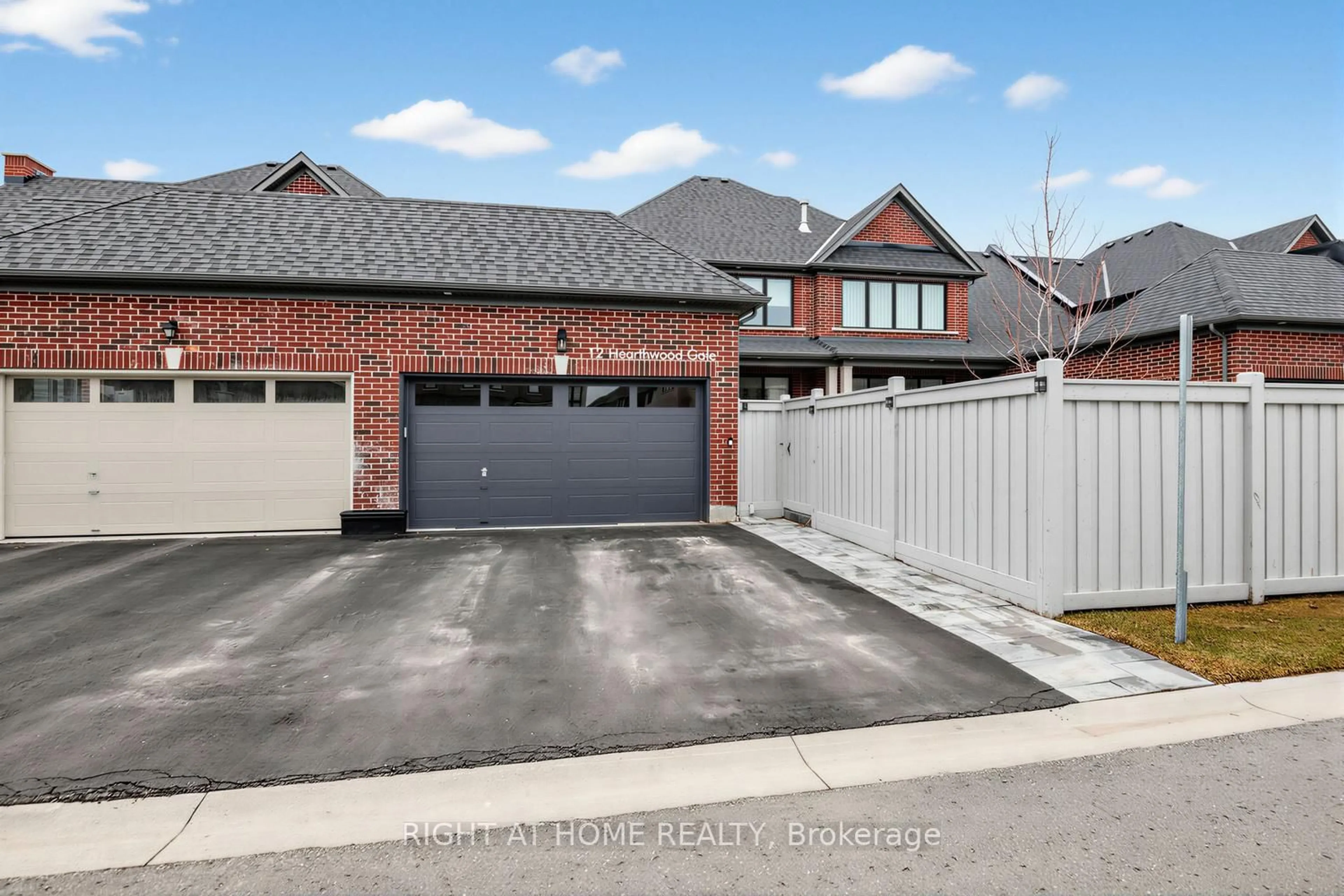 Home with brick exterior material, street for 12 Hearthwood Gate, Whitchurch-Stouffville Ontario L4A 4X1