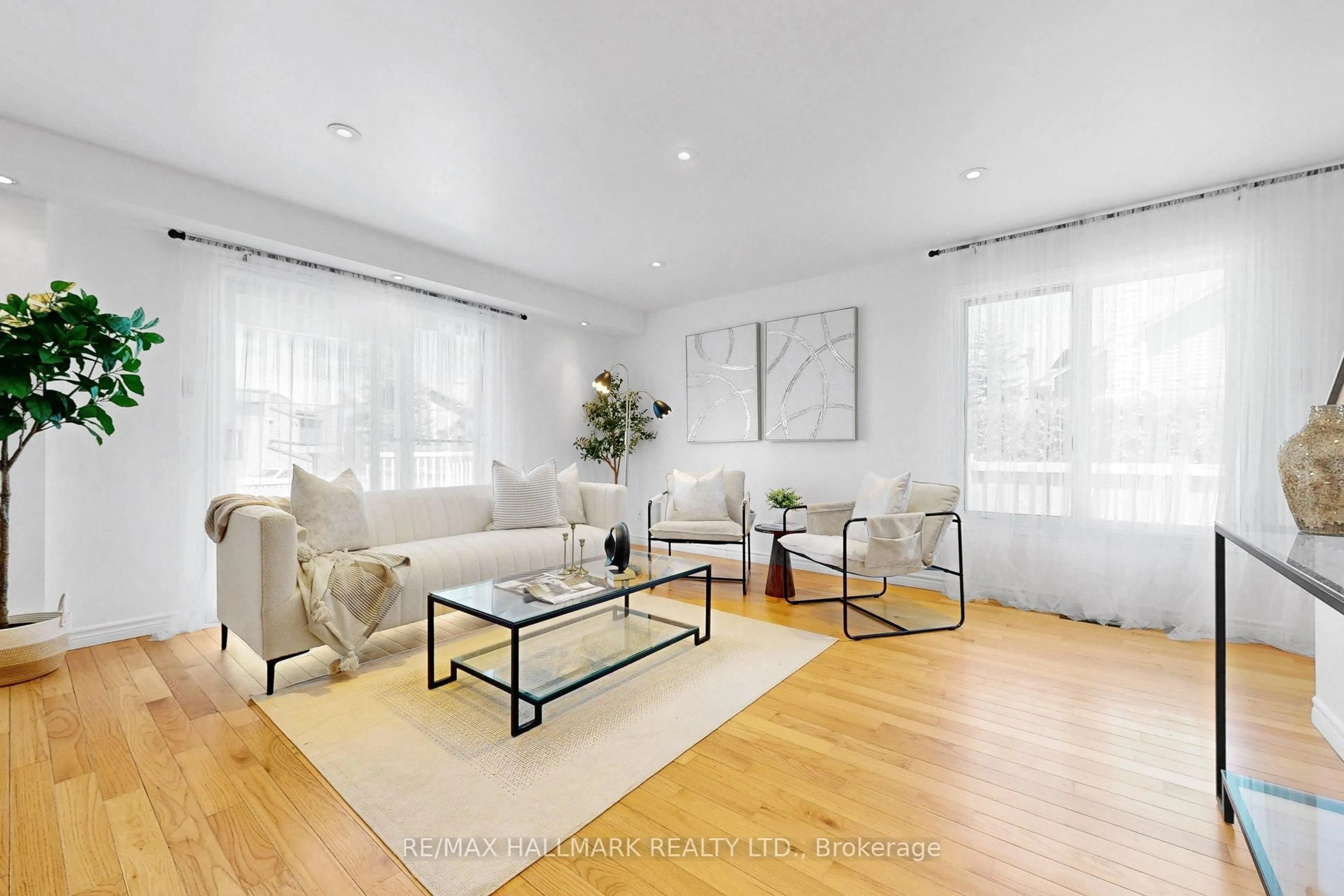 Living room with furniture, wood/laminate floor for 941 Lake Dr, Georgina Ontario L4P 3E9
