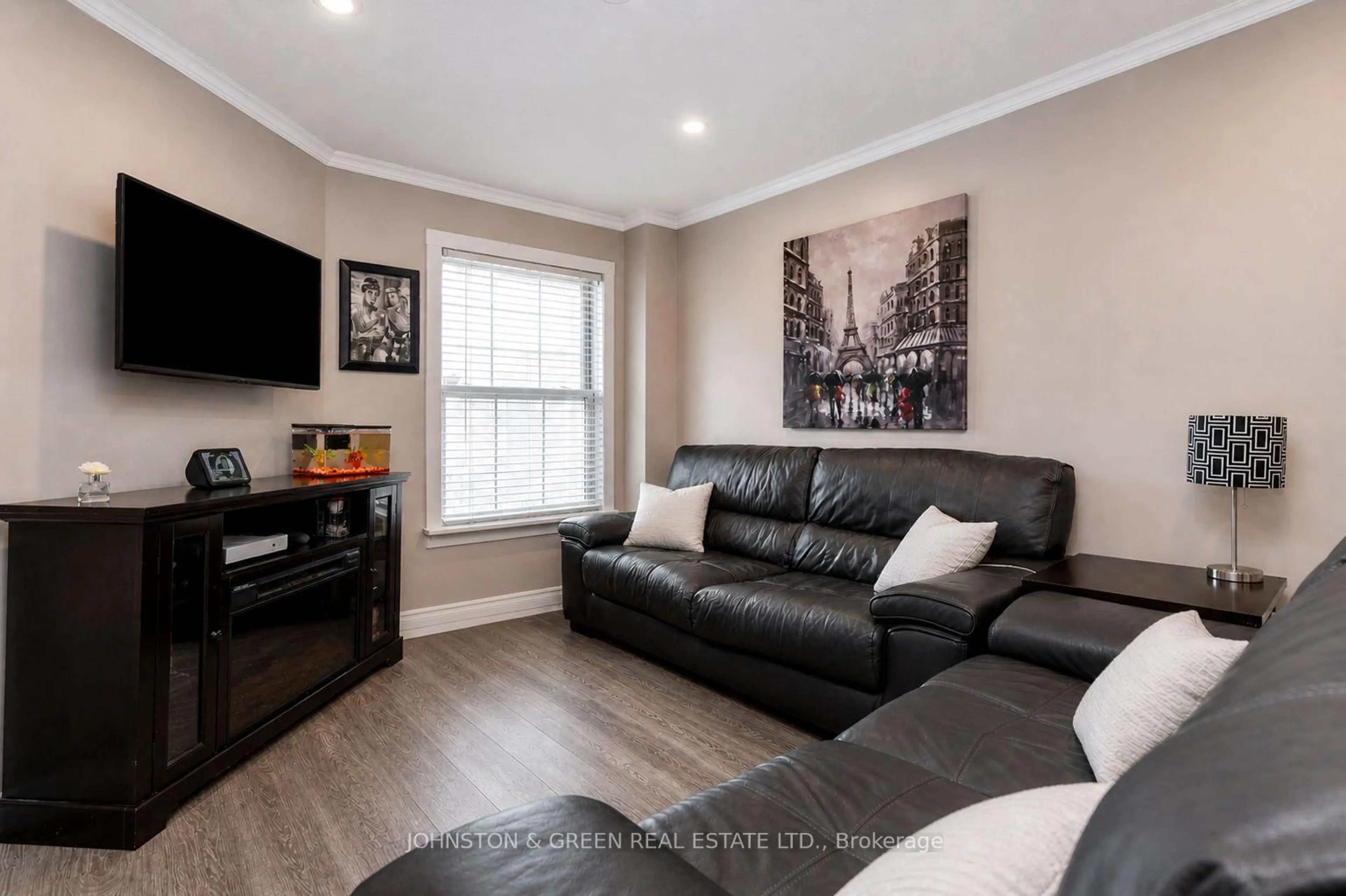 Living room with furniture, wood/laminate floor for 2198 Chalmers Cres, Innisfil Ontario L9S 1Y6