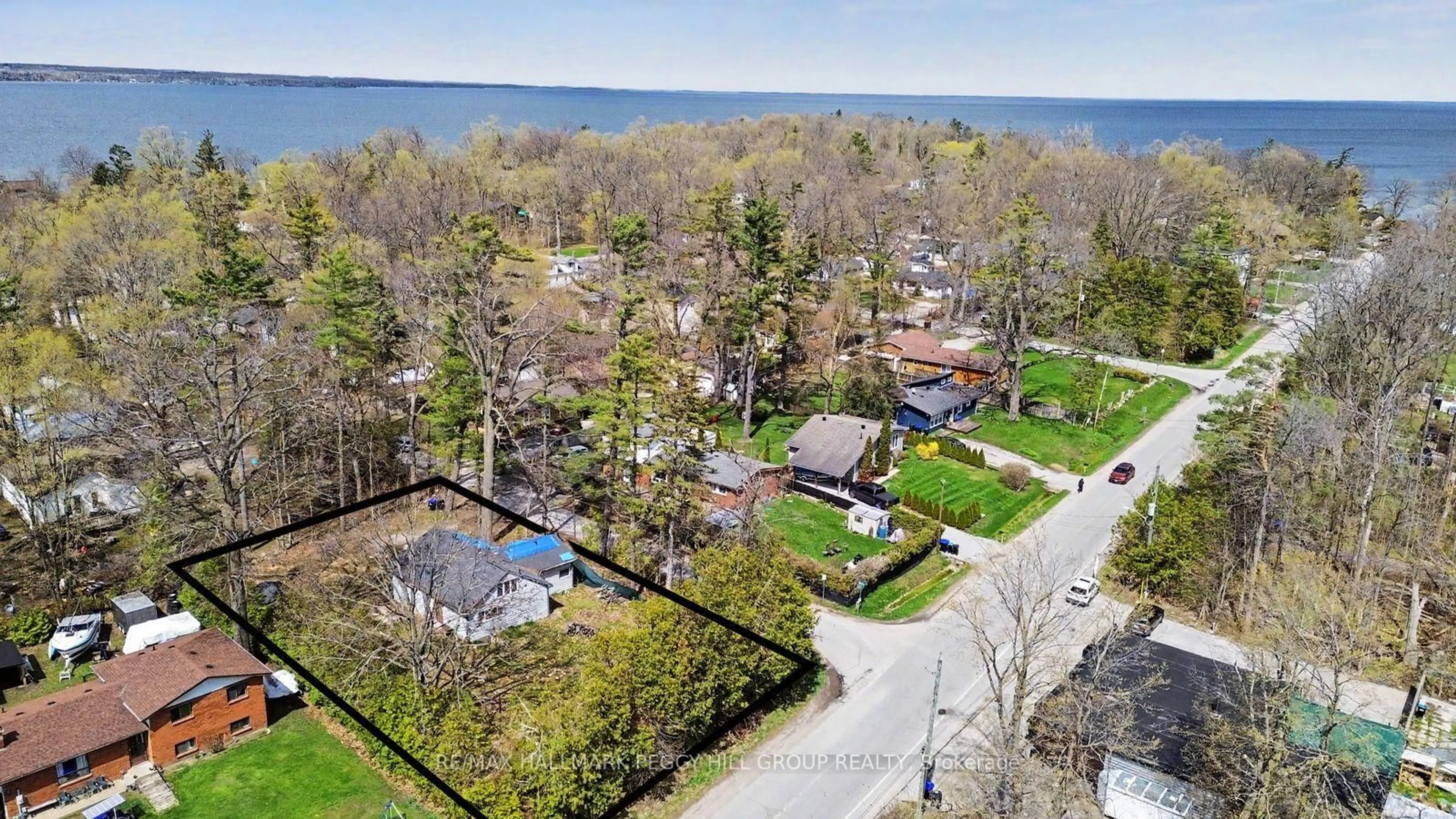A pic from outside/outdoor area/front of a property/back of a property/a pic from drone, water/lake/river/ocean view for 3910 Alcina Ave, Innisfil Ontario L9S 2M4