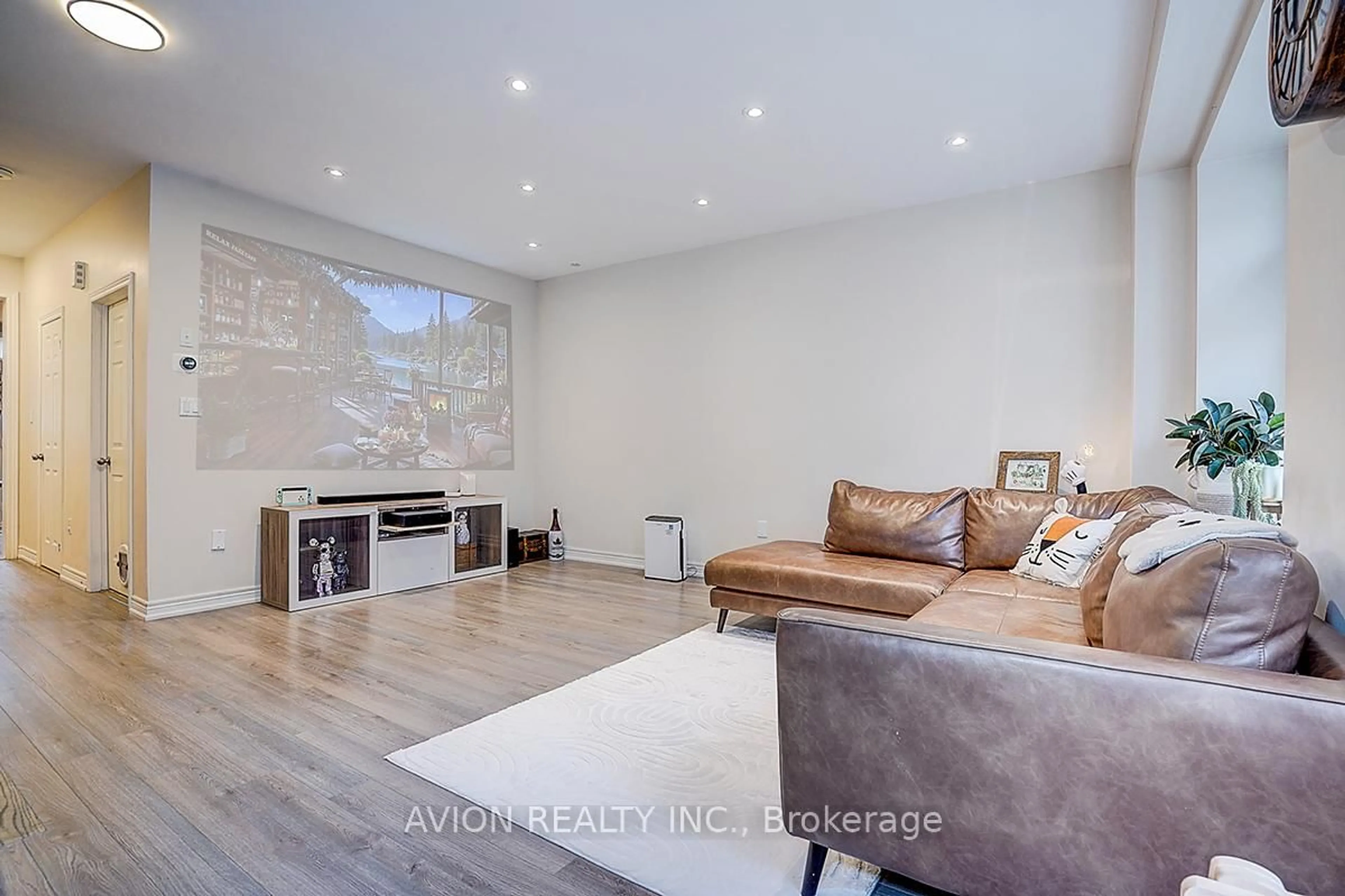 Living room with furniture, wood/laminate floor for 24 Fanny Grove Way, Markham Ontario L6E 0T6