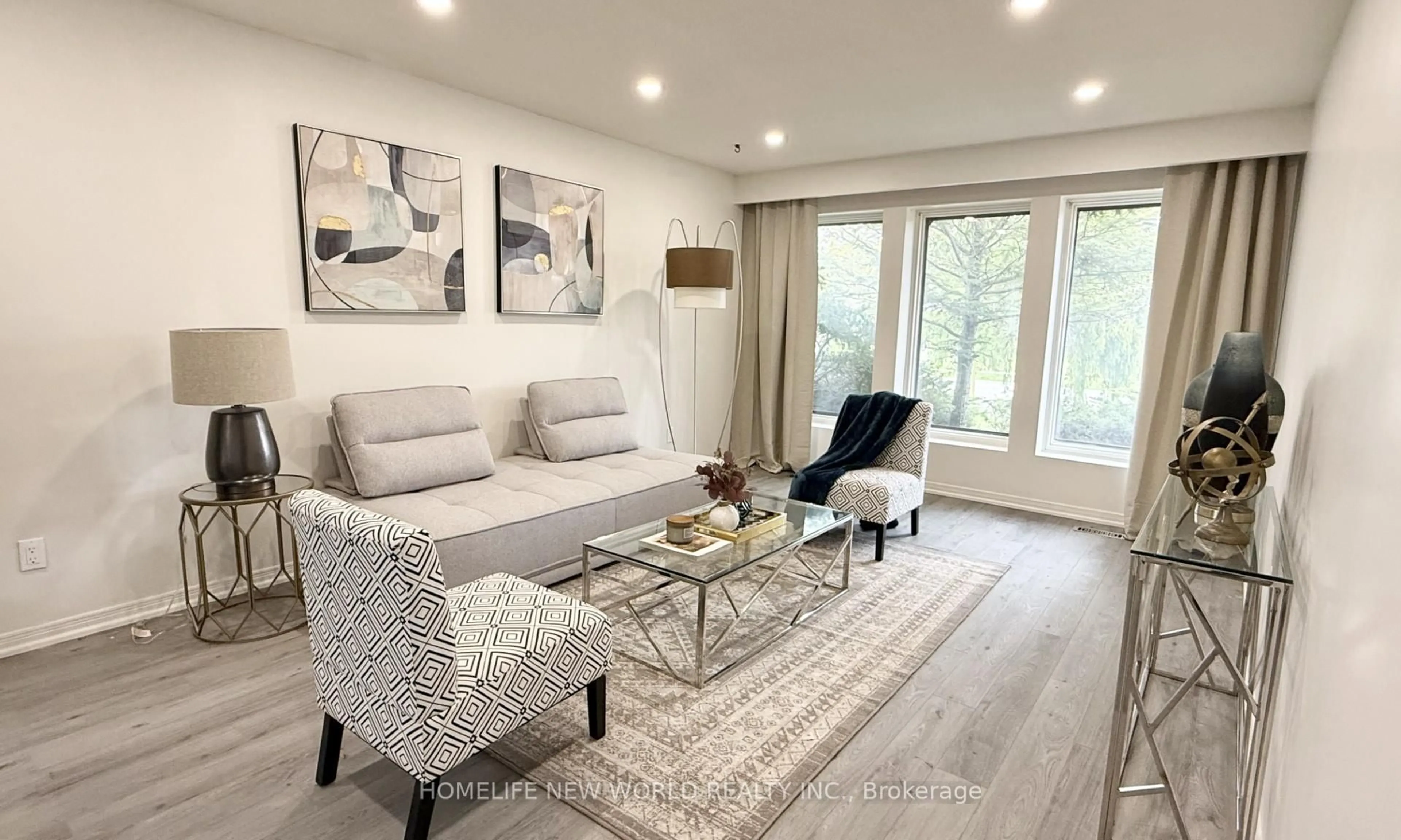Living room with furniture, wood/laminate floor for 93 Willowbrook Rd, Markham Ontario L3T 5K7