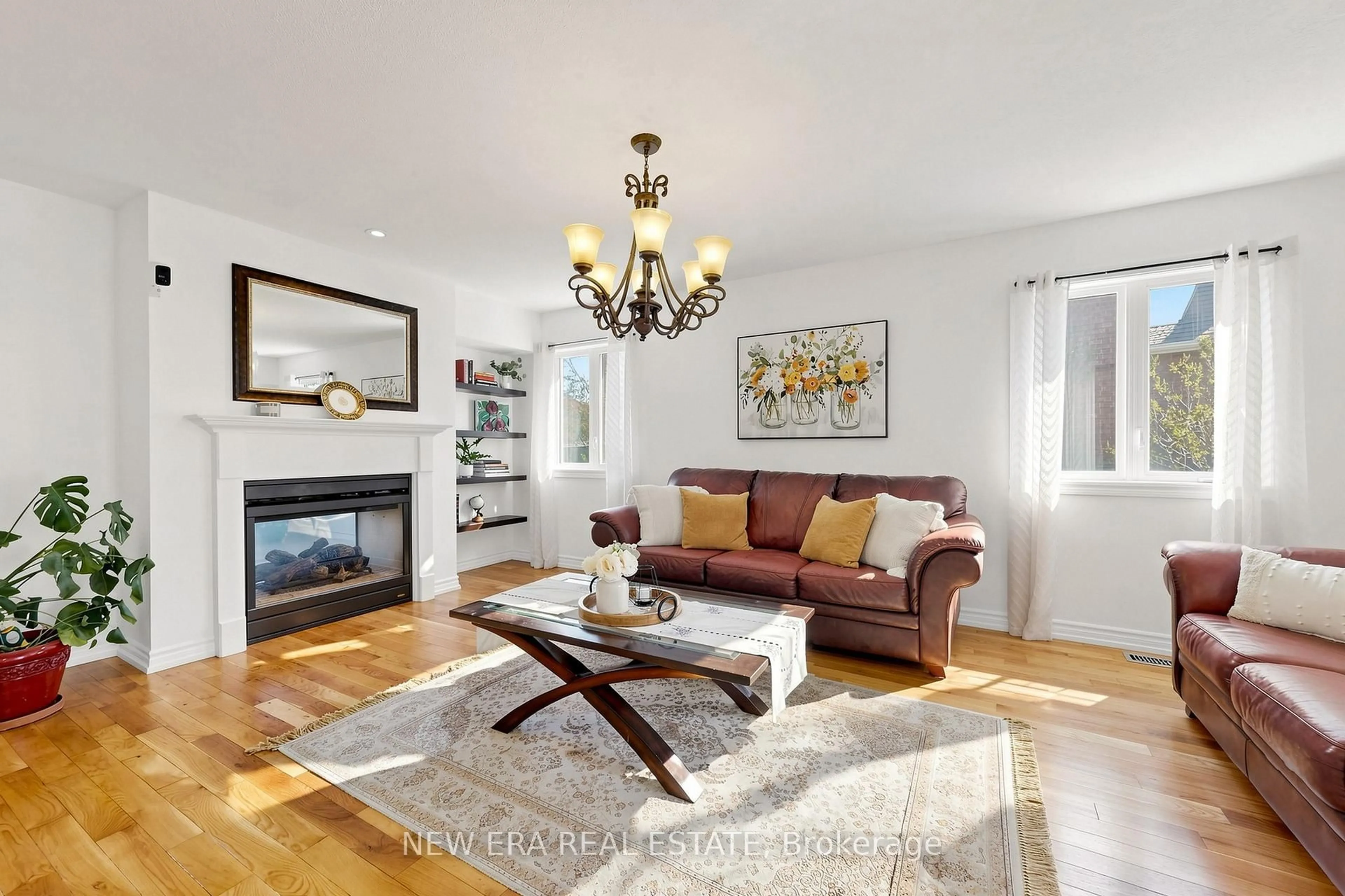 Living room with furniture, wood/laminate floor for 61 Orville Hand Crt, Bradford West Gwillimbury Ontario L3Z 0C2