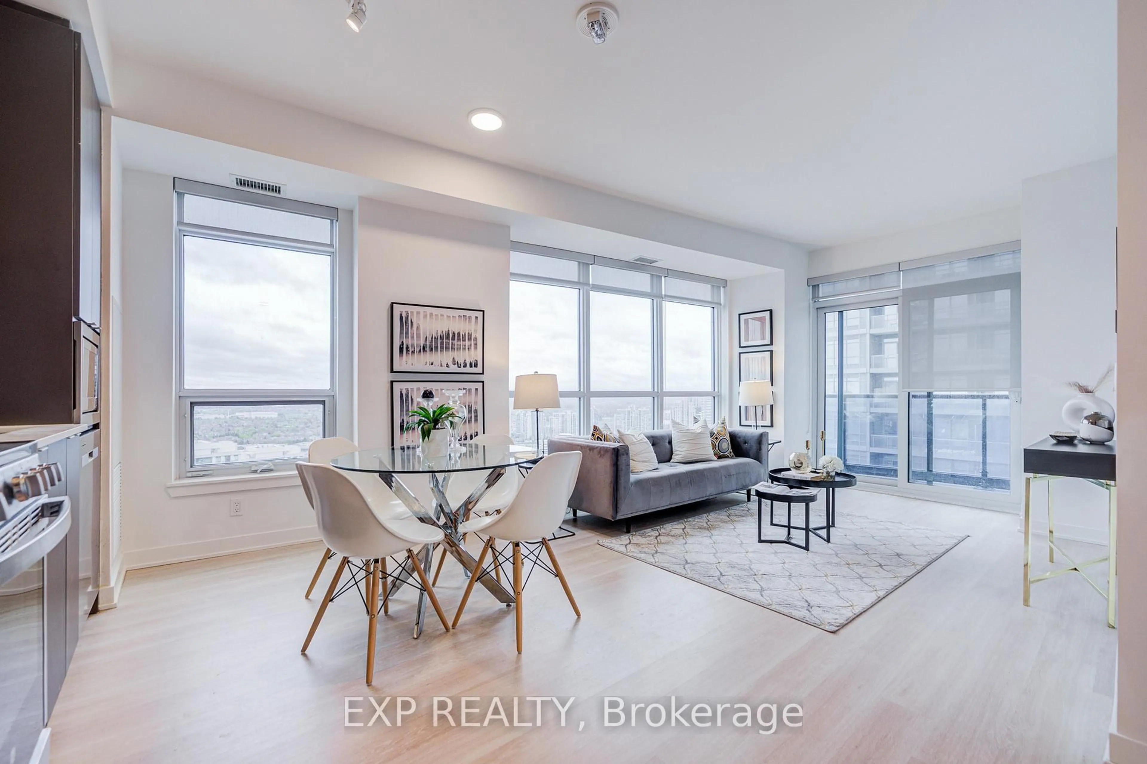 Living room with furniture, wood/laminate floor for 30 Upper Mall Way #2707, Vaughan Ontario L4J 0L7