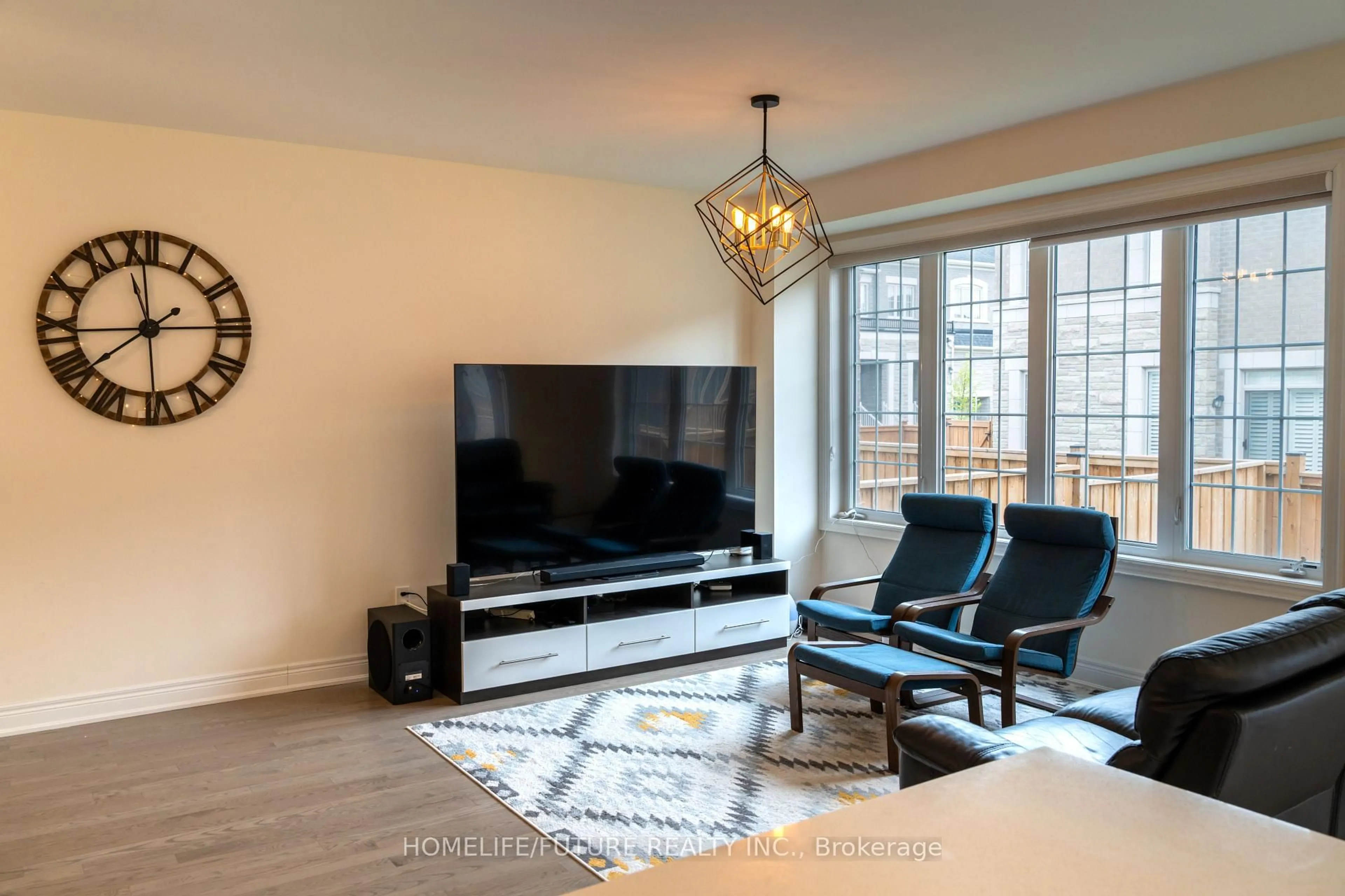 Living room with furniture, wood/laminate floor for 357 Kirkham Dr, Markham Ontario L3S 0E8