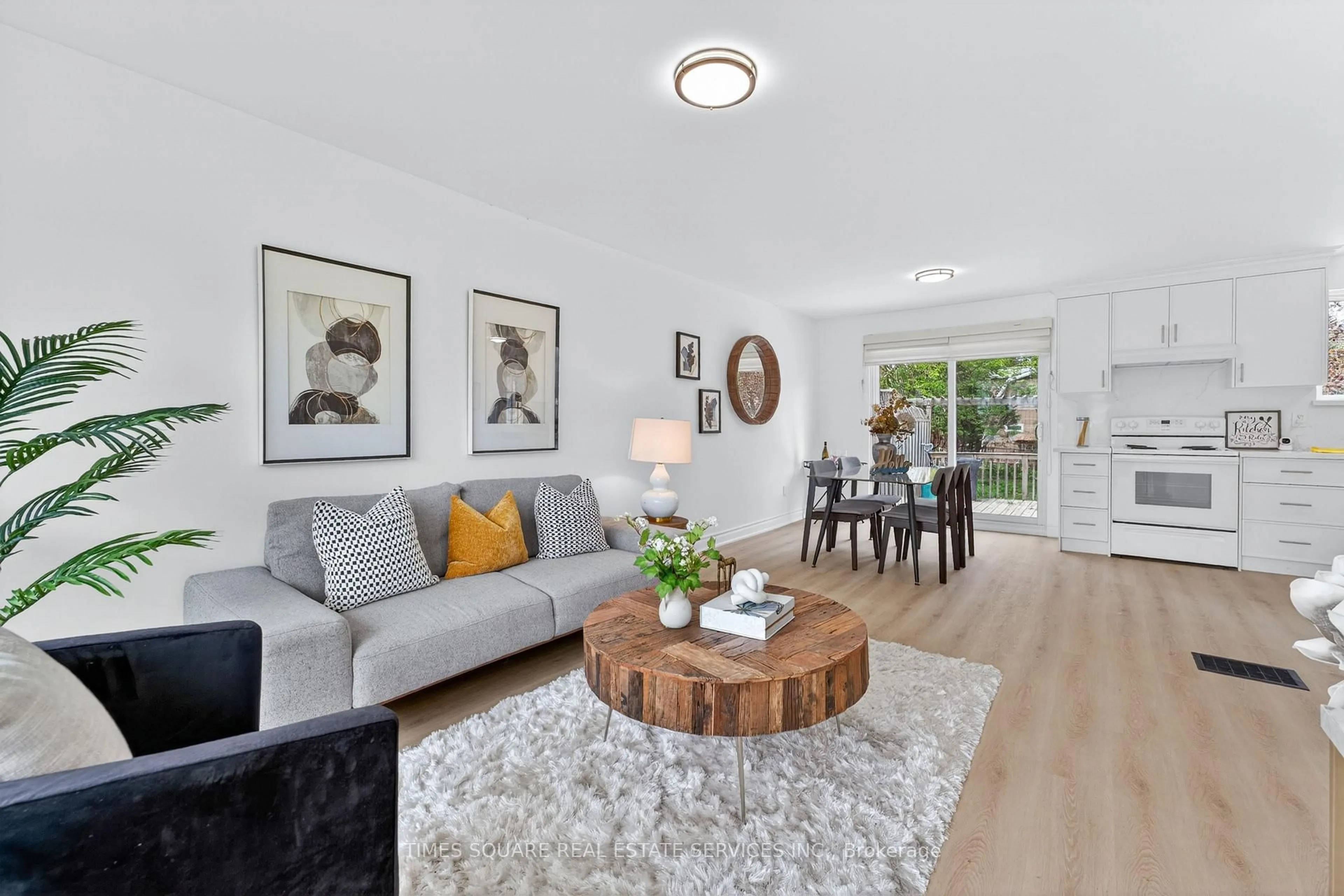 Living room with furniture, wood/laminate floor for 230 East St, East Gwillimbury Ontario L9N 1K8