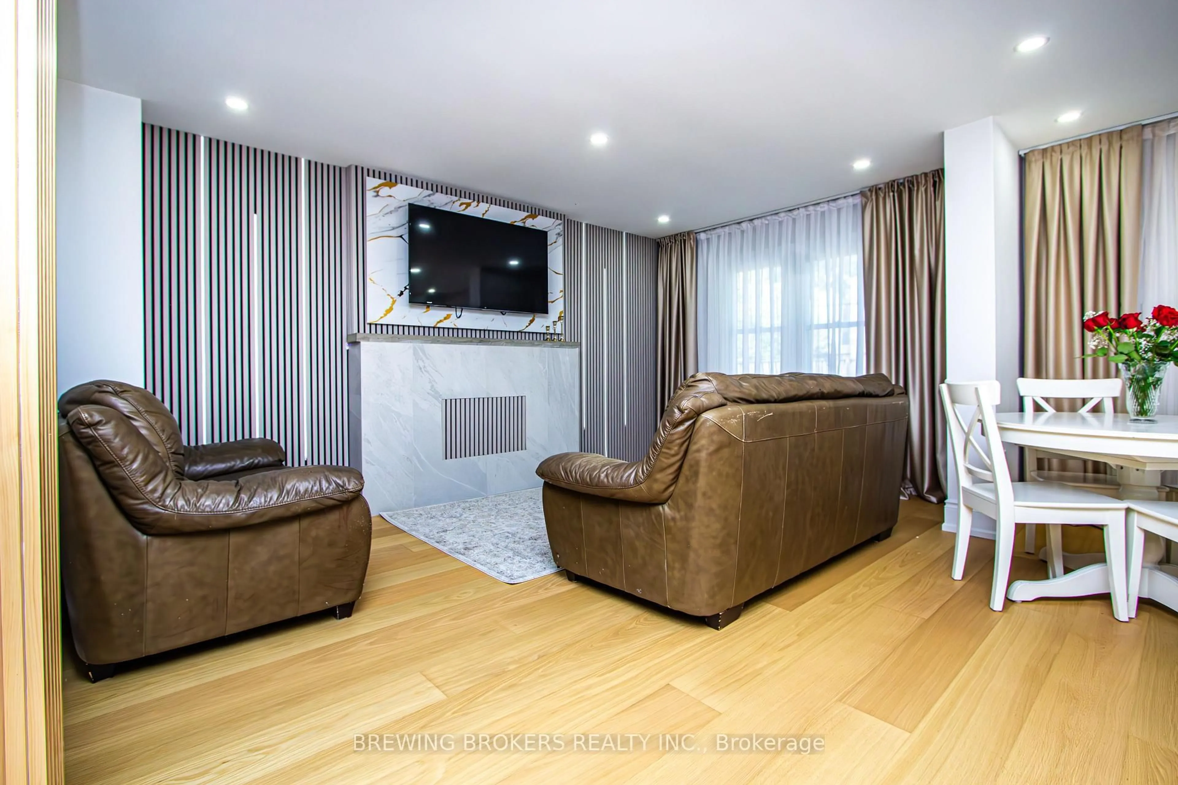 Living room with furniture, wood/laminate floor for 63 Marita Pl, Vaughan Ontario L4K 3J8