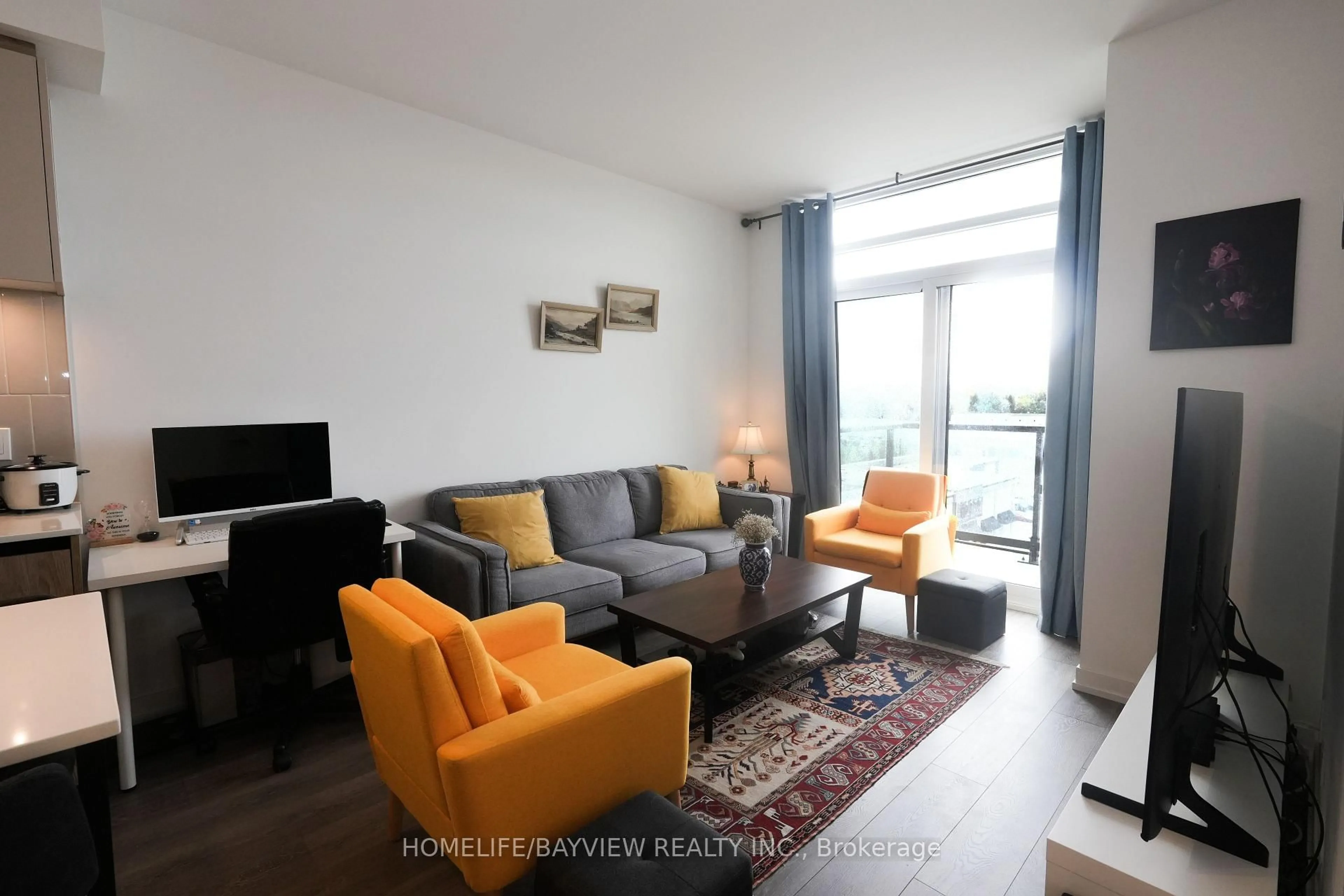 Living room with furniture, wood/laminate floor for 8 Beverley Glen Blvd #603, Vaughan Ontario L4K 0L5