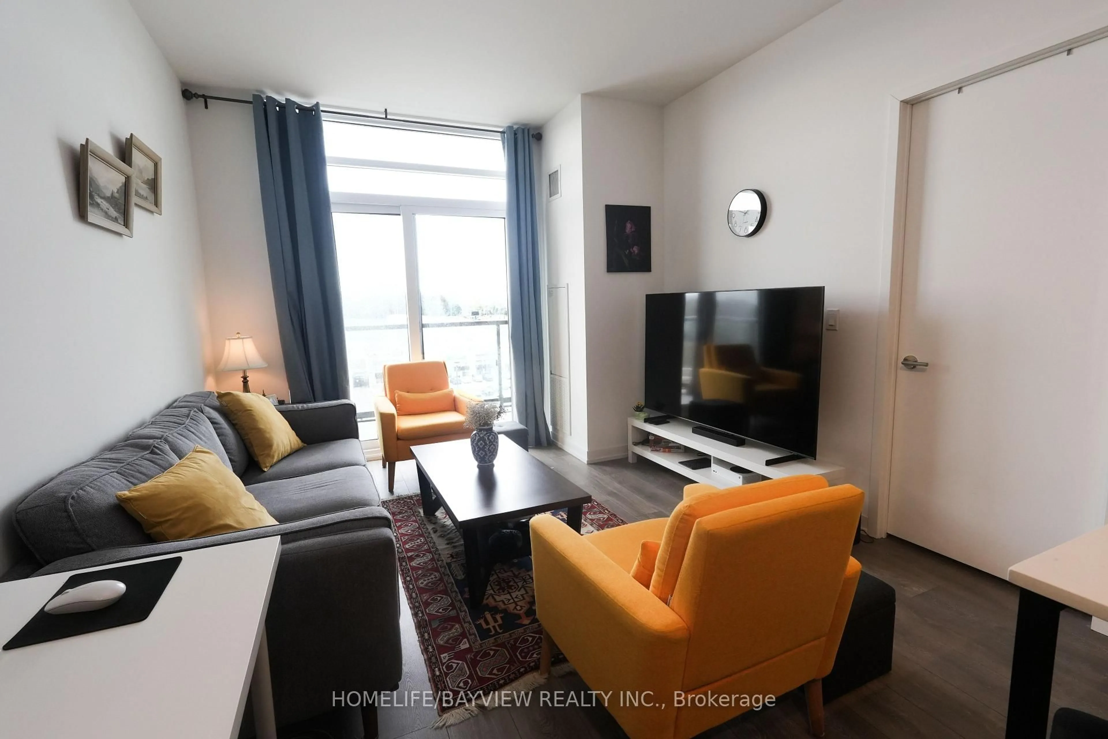 Living room with furniture, wood/laminate floor for 8 Beverley Glen Blvd #603, Vaughan Ontario L4K 0L5