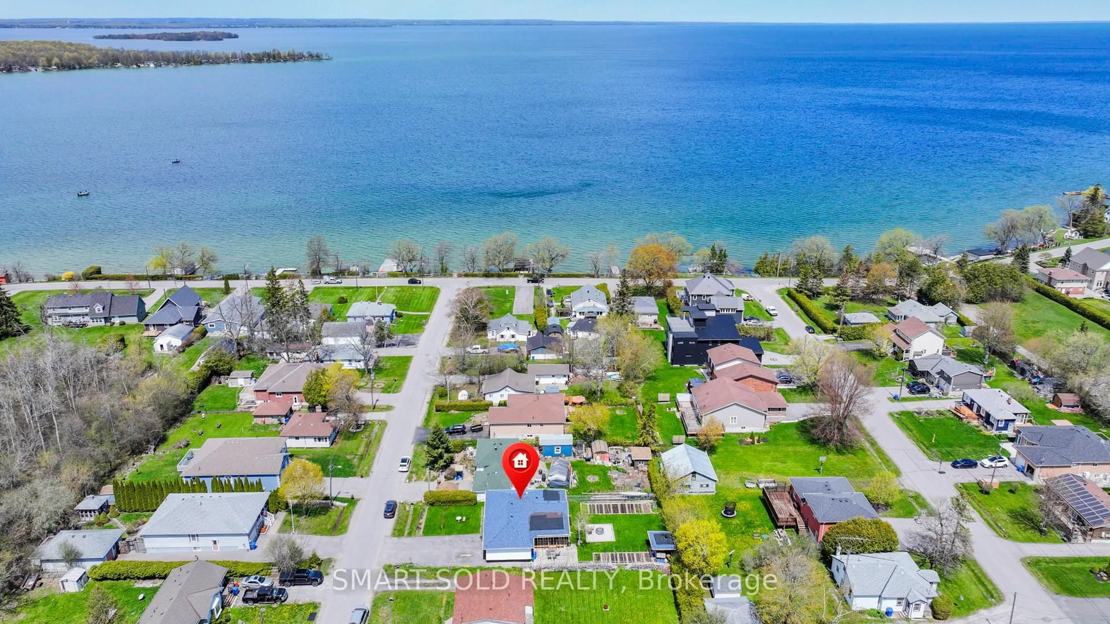 A pic from outside/outdoor area/front of a property/back of a property/a pic from drone, water/lake/river/ocean view for 831 Norval Rd, Georgina Ontario L4P 3E9
