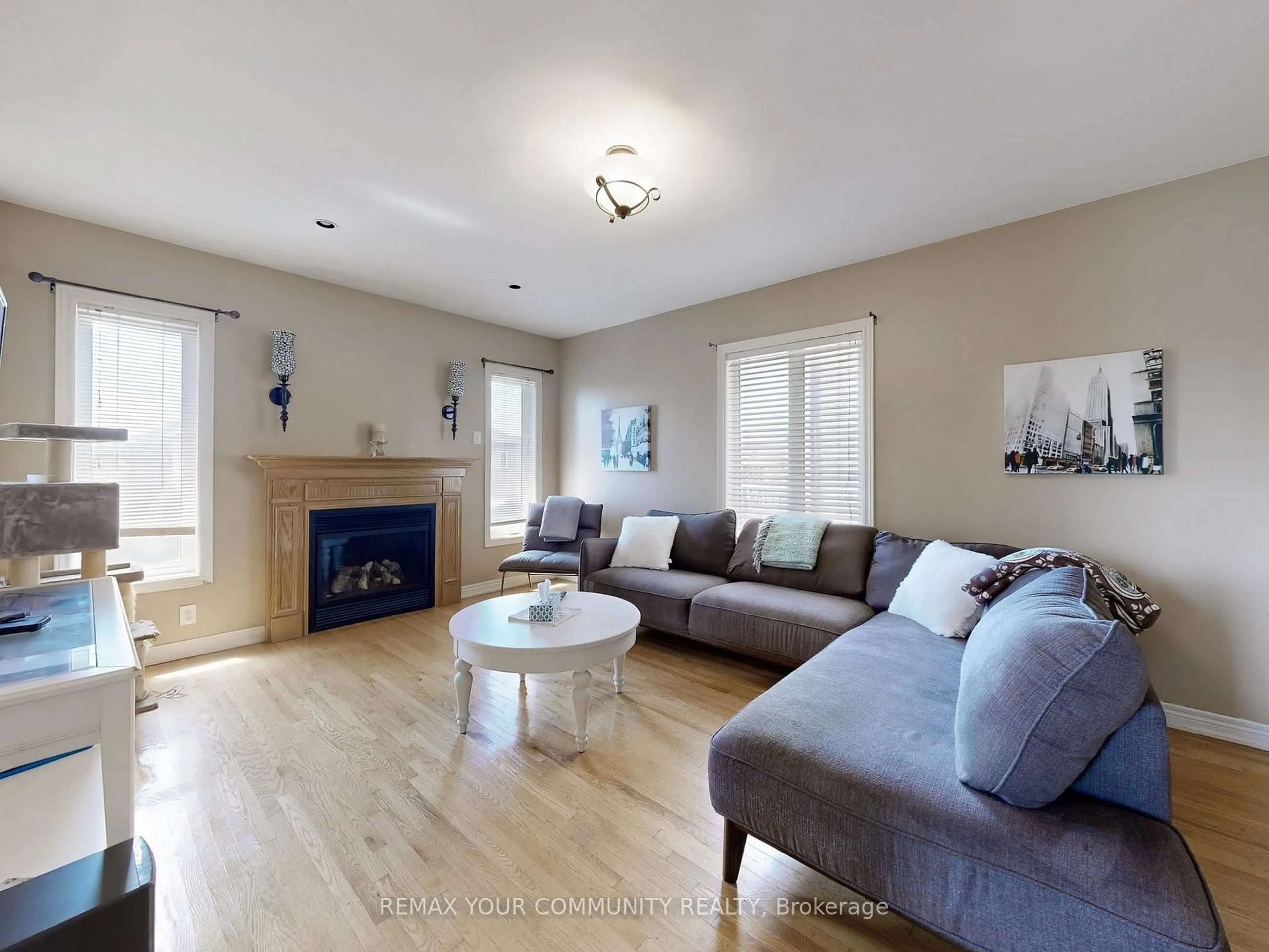 Living room with furniture, wood/laminate floor for 24 Cachet Hill Cres, Vaughan Ontario L4H 1S6