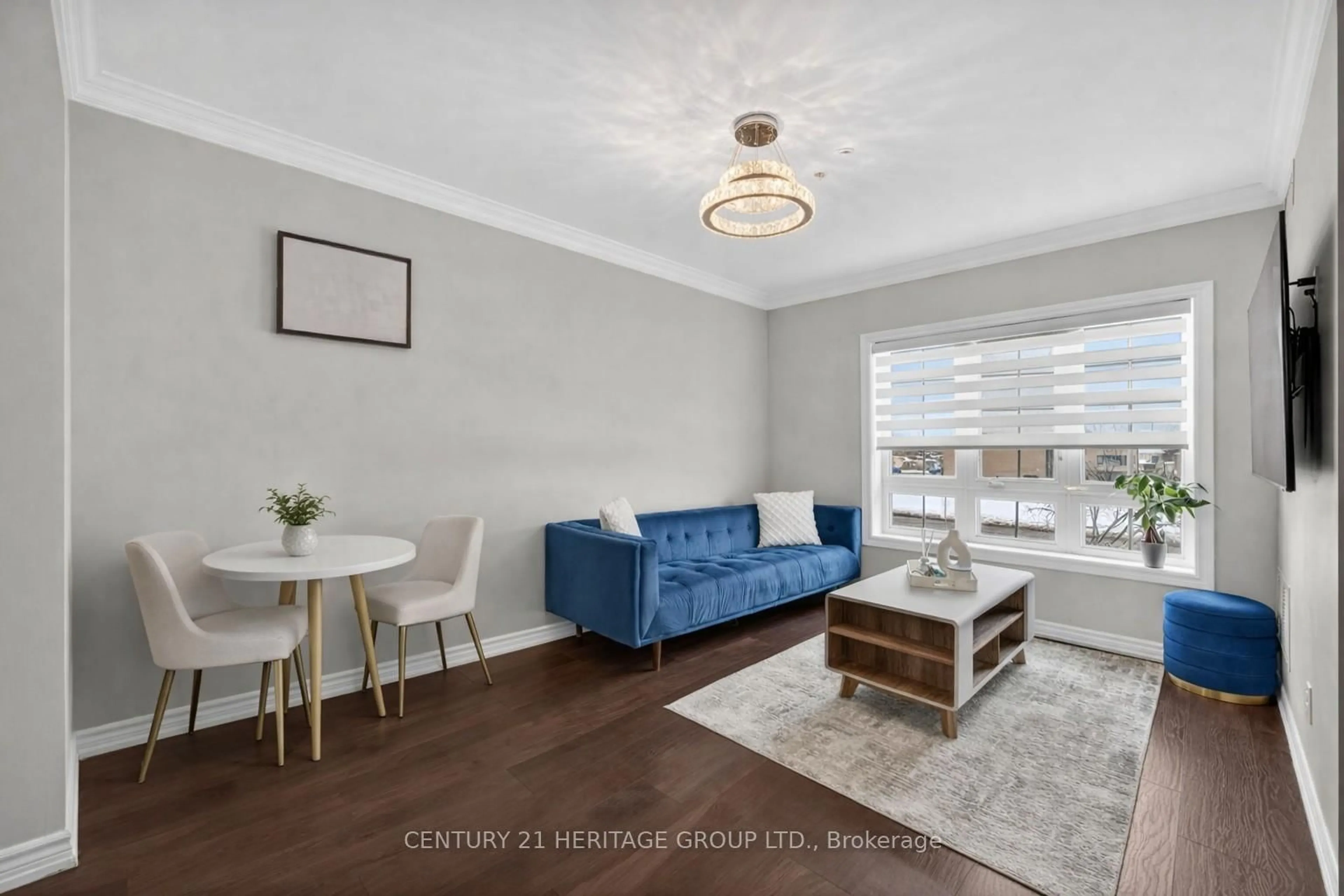 Living room with furniture, wood/laminate floor for 112 Simcoe Rd #214, Bradford West Gwillimbury Ontario L3Z 1Y2