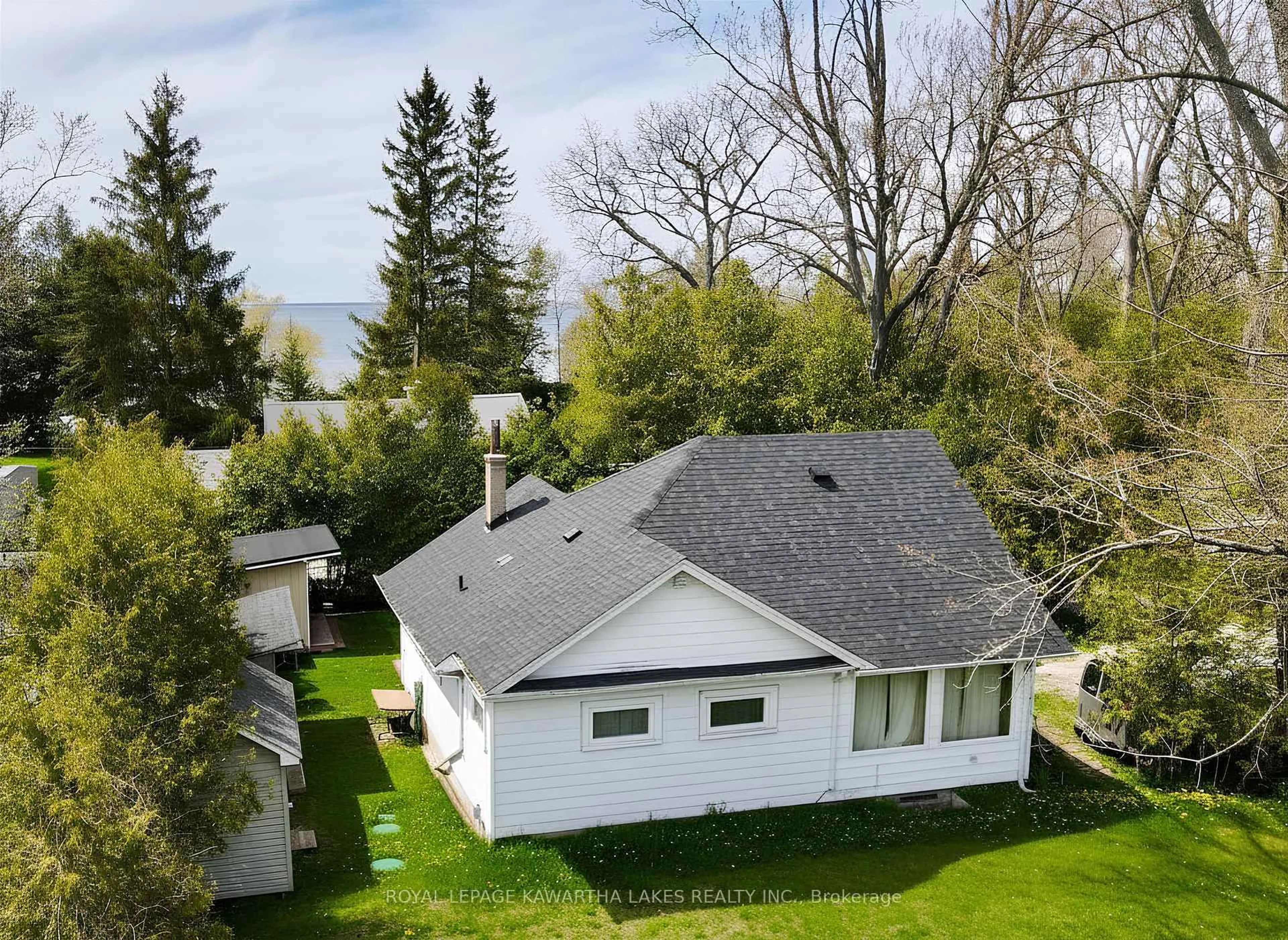 A pic from outside/outdoor area/front of a property/back of a property/a pic from drone, water/lake/river/ocean view for 8 Sandy Cove Lane, Georgina Ontario L4P 3E9