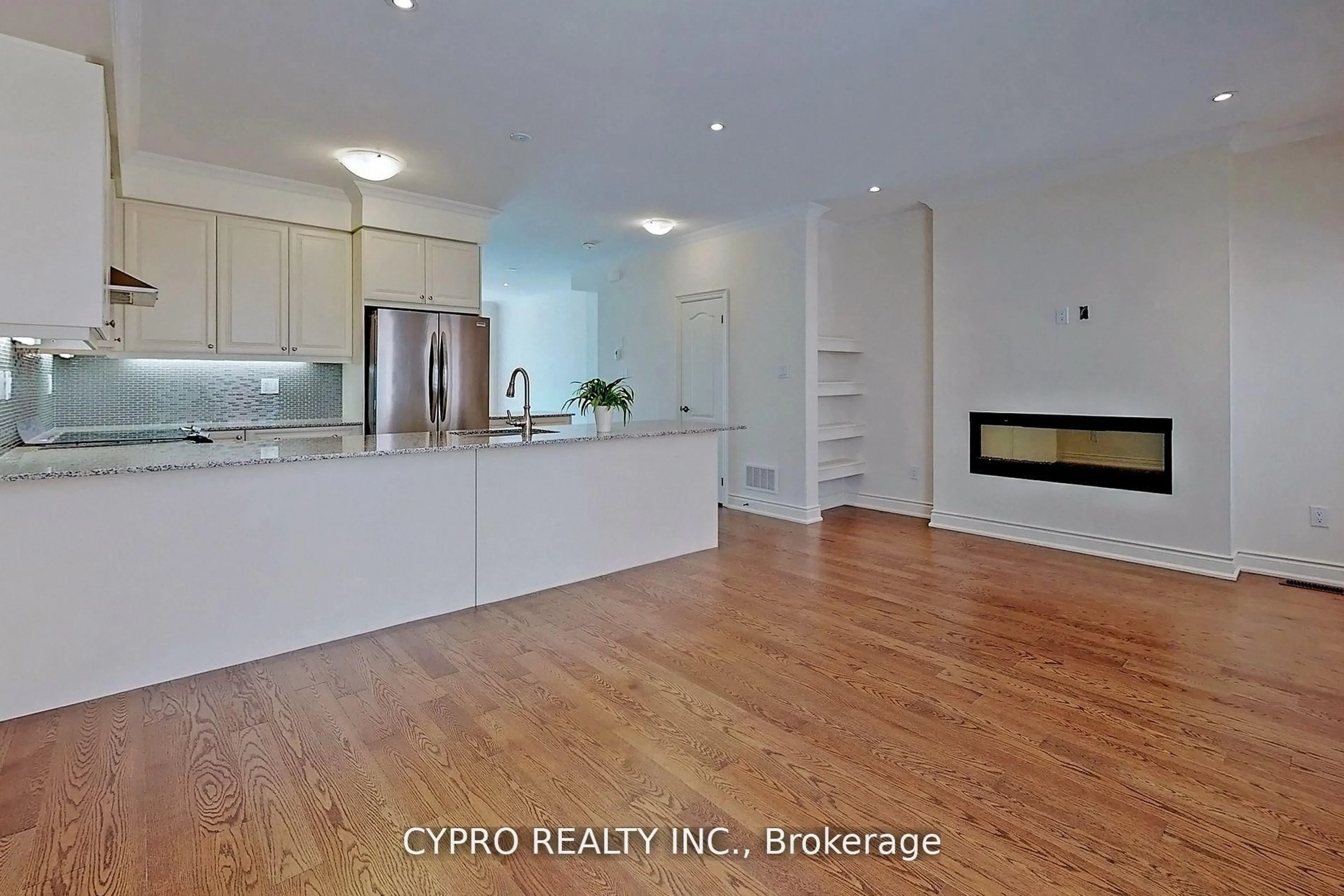 Open concept kitchen, wood/laminate floor for 78 William Saville St, Markham Ontario L3R 9S3