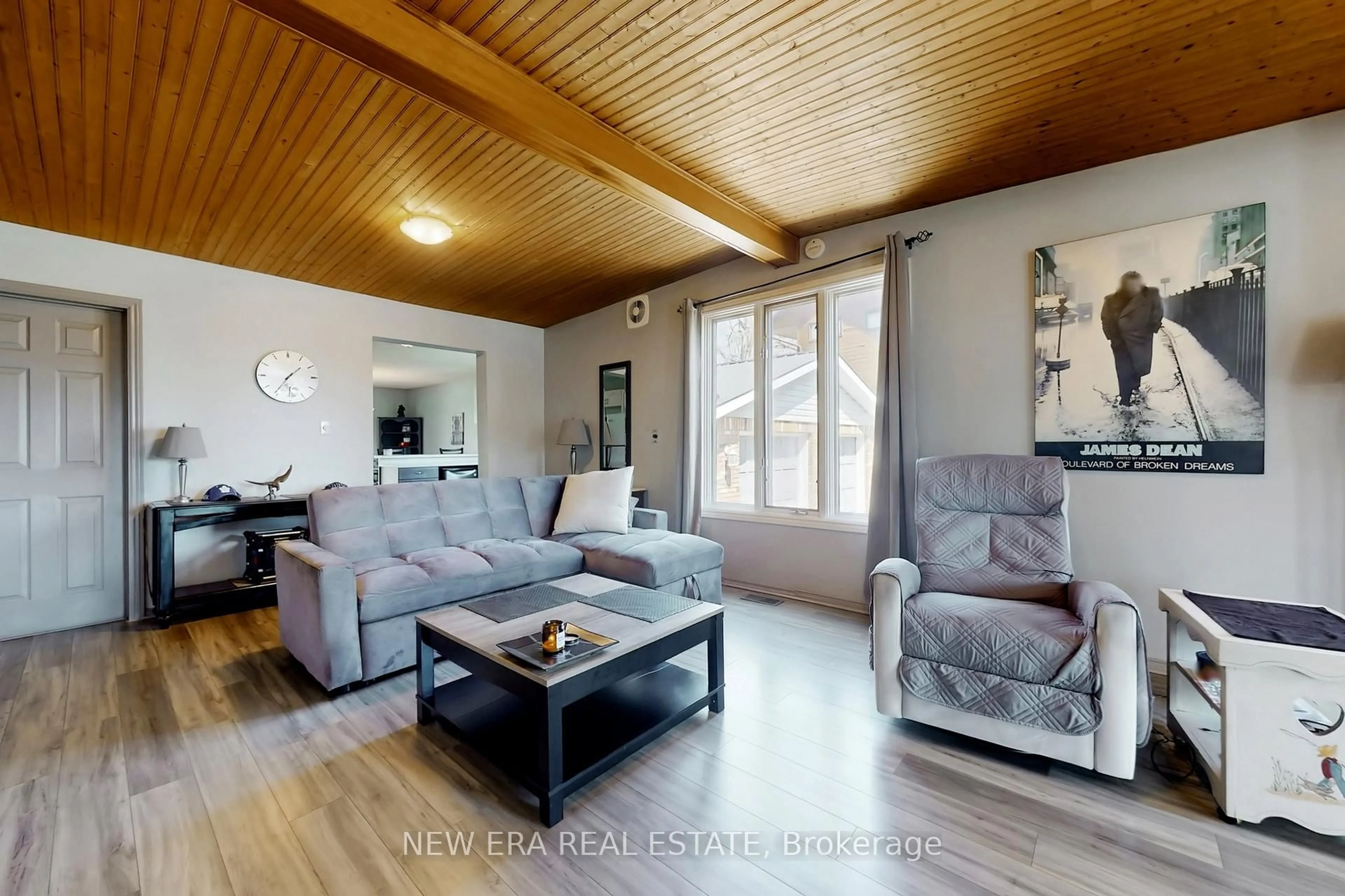 Living room with furniture, wood/laminate floor for 26 Big Bay Point Rd, Innisfil Ontario L9S 2N9
