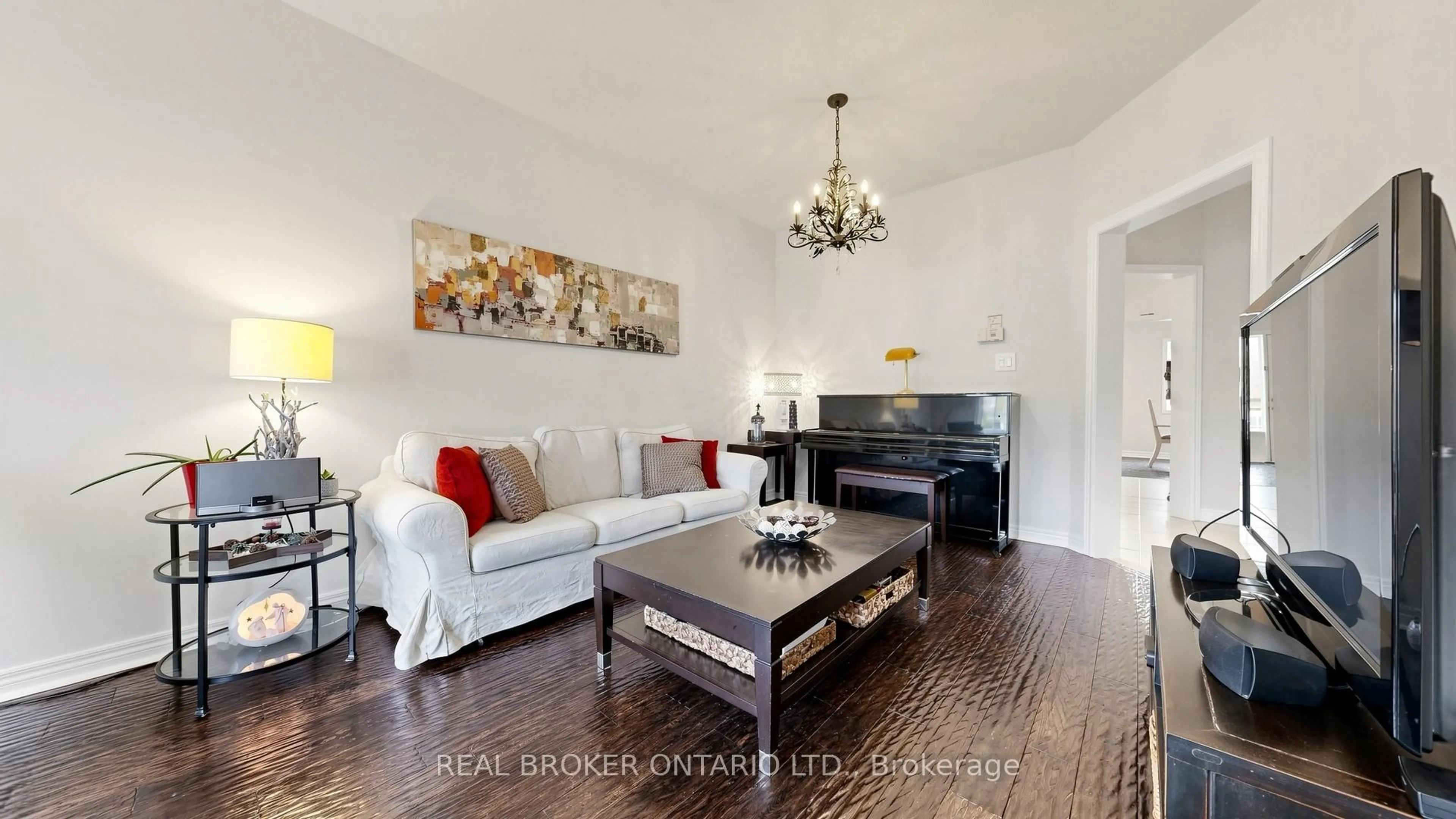 Living room with furniture, wood/laminate floor for 23 Piera Gdns, Markham Ontario L3R 5G8