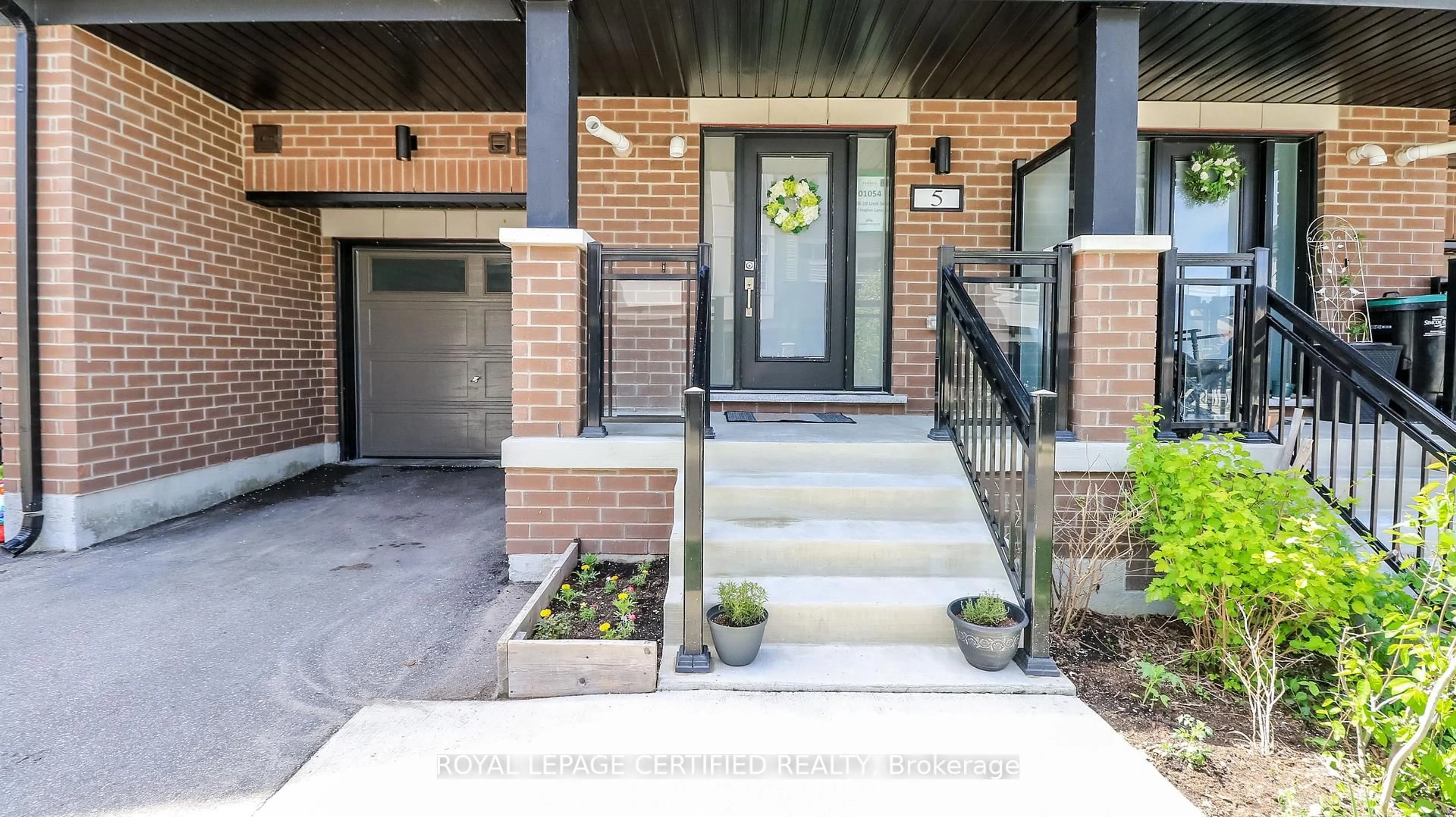 Home with brick exterior material, street for 5 Hughes Lane #54, New Tecumseth Ontario L0G 1W0
