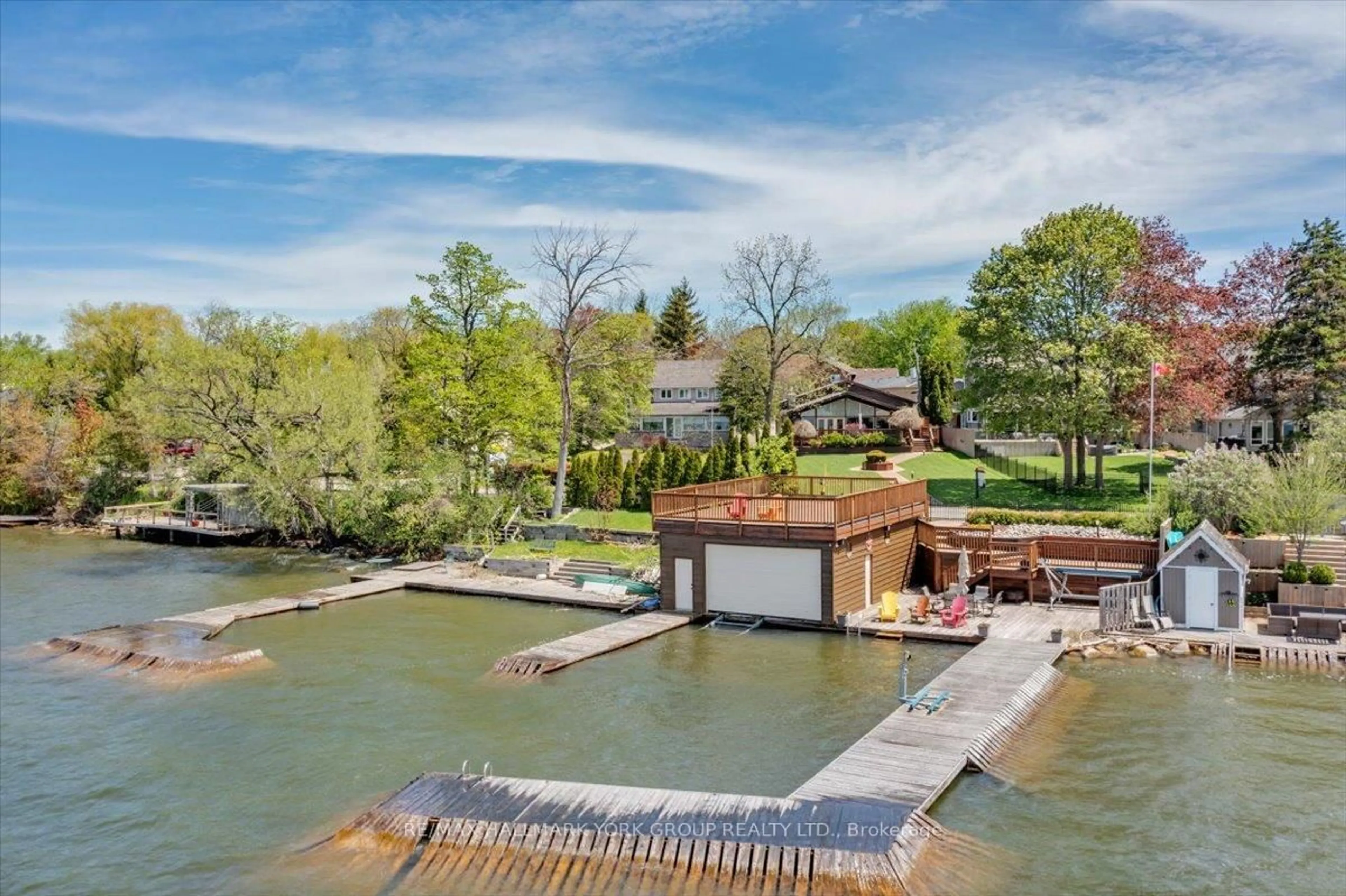 A pic from outside/outdoor area/front of a property/back of a property/a pic from drone, water/lake/river/ocean view for 229 Lake Dr, Georgina Ontario L4P 3C8