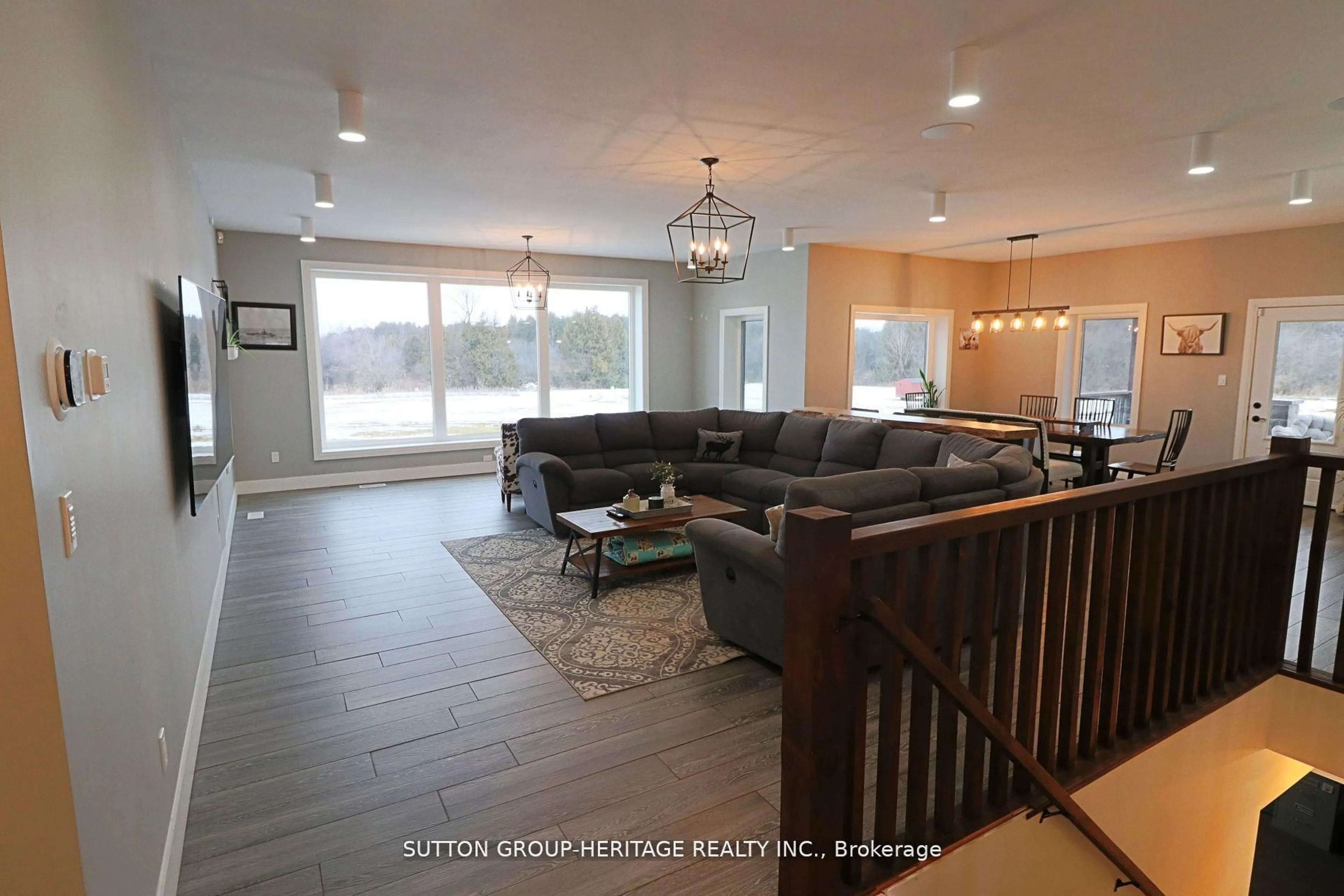 Living room with furniture, wood/laminate floor for 1766 Concession 13 Rd, Brock Ontario L0E 1E0