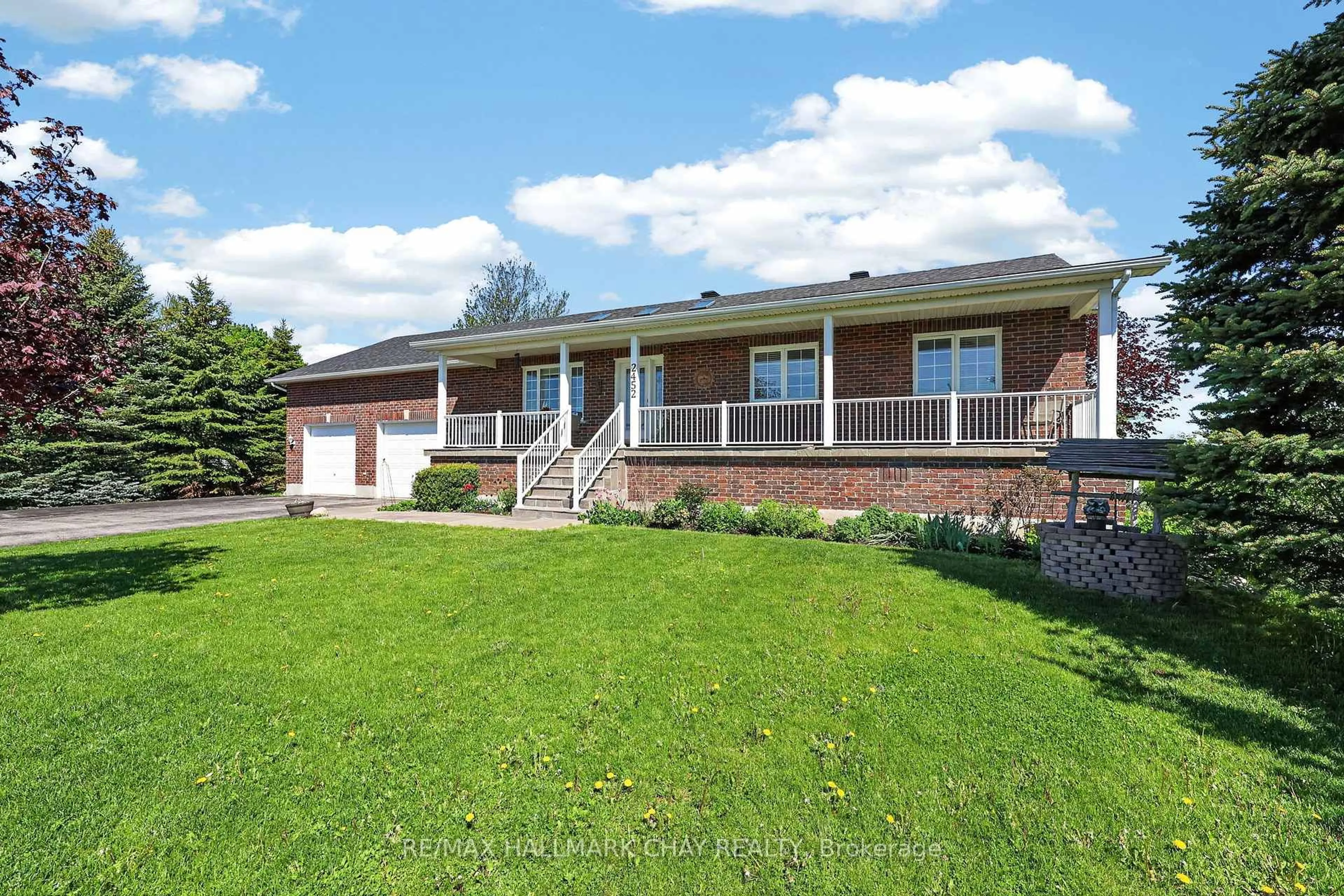 A pic from outside/outdoor area/front of a property/back of a property/a pic from drone, street for 2452 10th Line, Innisfil Ontario L9S 3R2