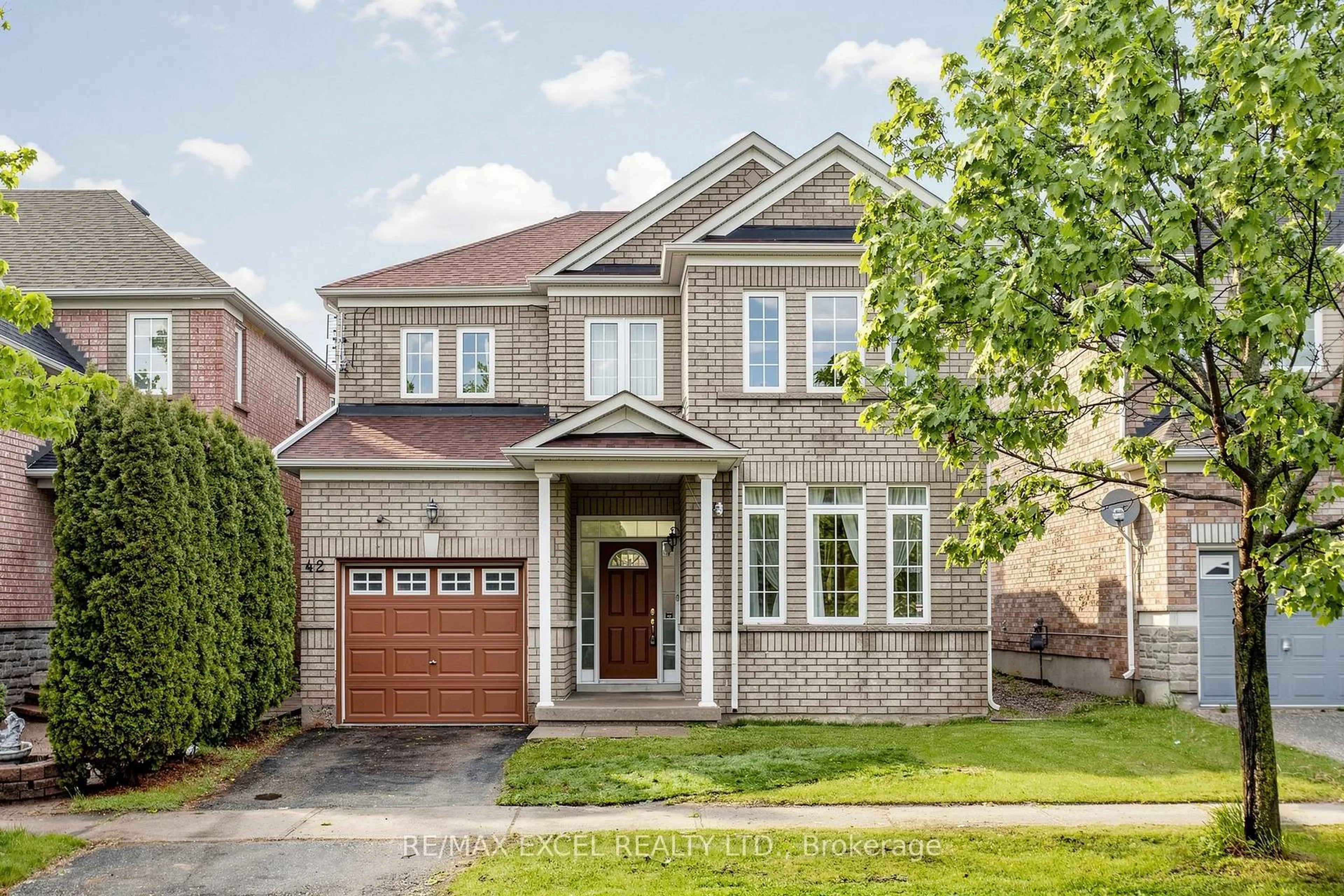 Home with brick exterior material, street for 42 Chasser Dr, Markham Ontario L6E 1S6