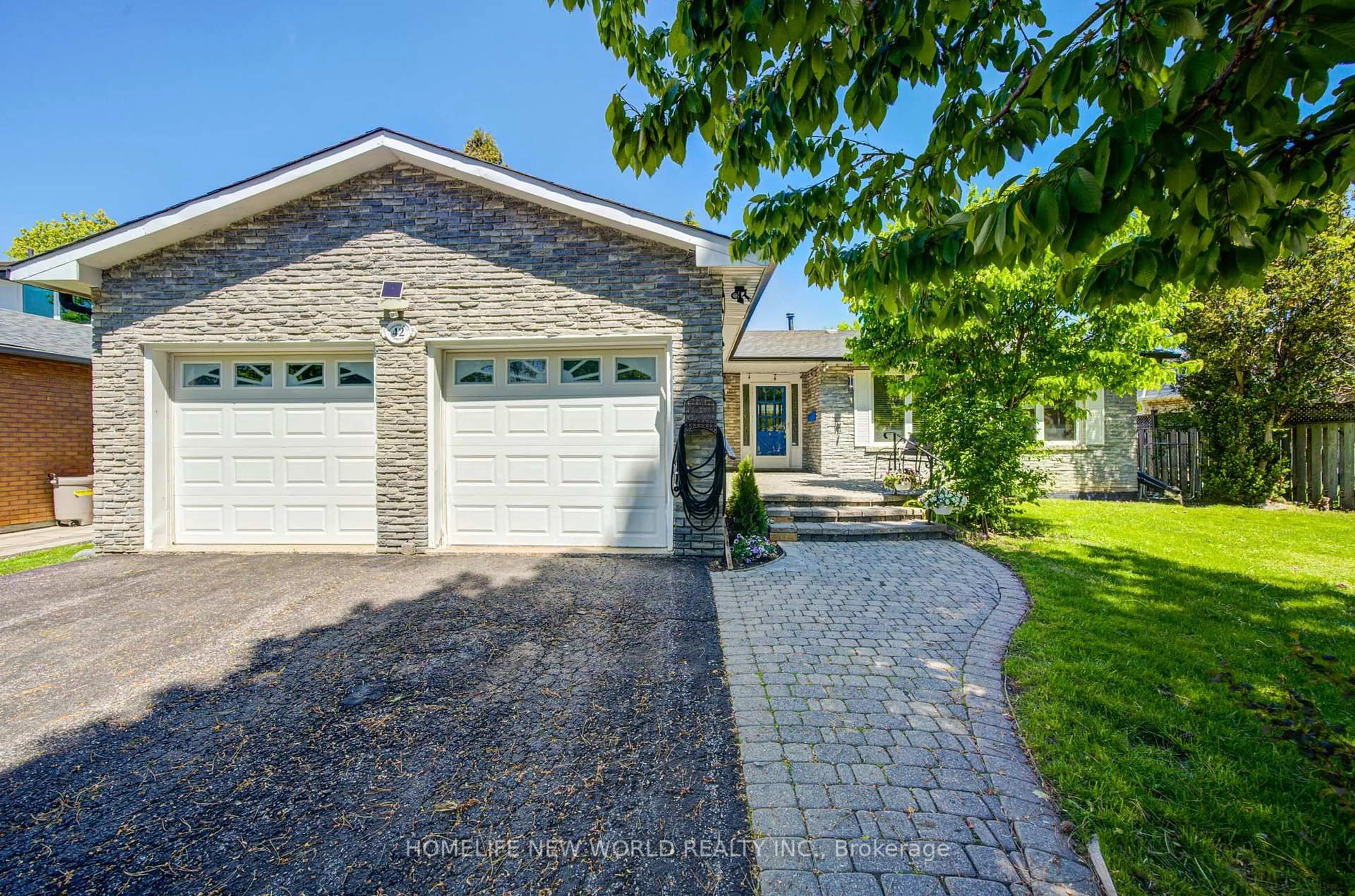 Home with brick exterior material, street for 42 Hamilton Hall Dr, Markham Ontario L3P 3L6