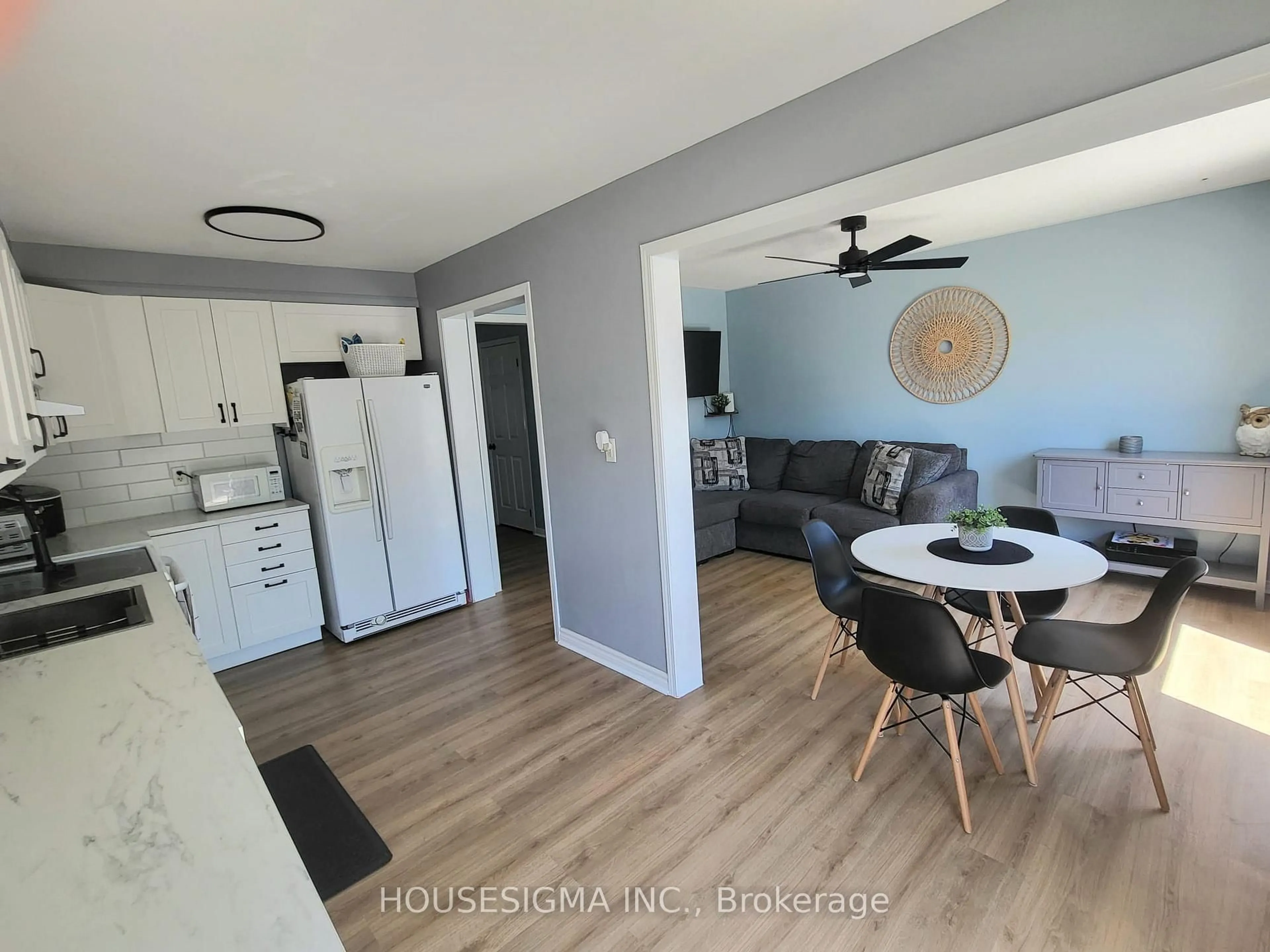 Open concept kitchen, wood/laminate floor for 58 Lookout St, Essa Ontario L0M 1B4