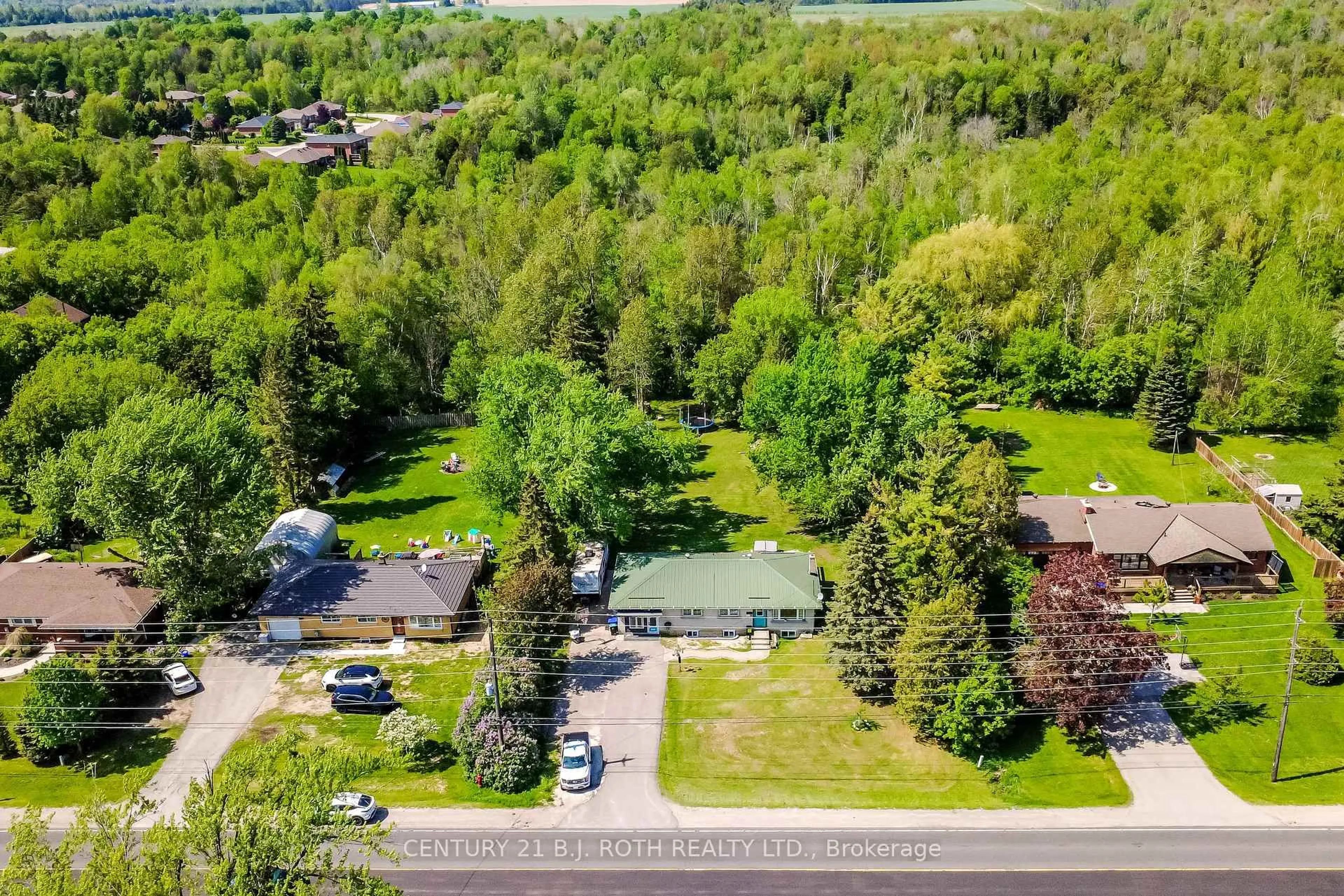 A pic from outside/outdoor area/front of a property/back of a property/a pic from drone, forest/trees view for 7906 Main St, Adjala-Tosorontio Ontario L0M 1J0