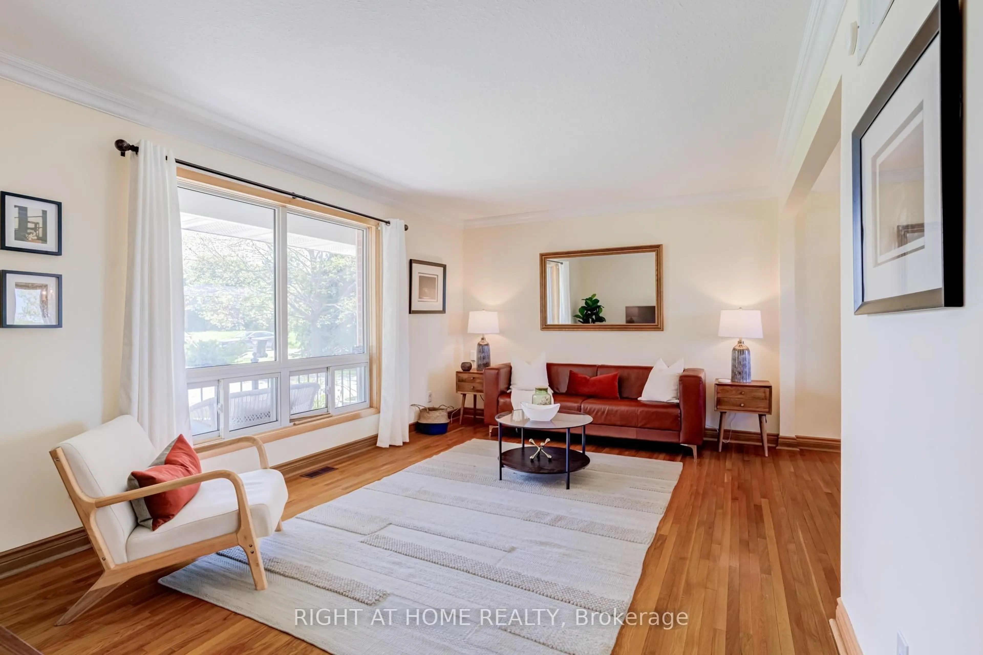 Living room with furniture, wood/laminate floor for 24 Joseph St, Adjala-Tosorontio Ontario L0G 1L0
