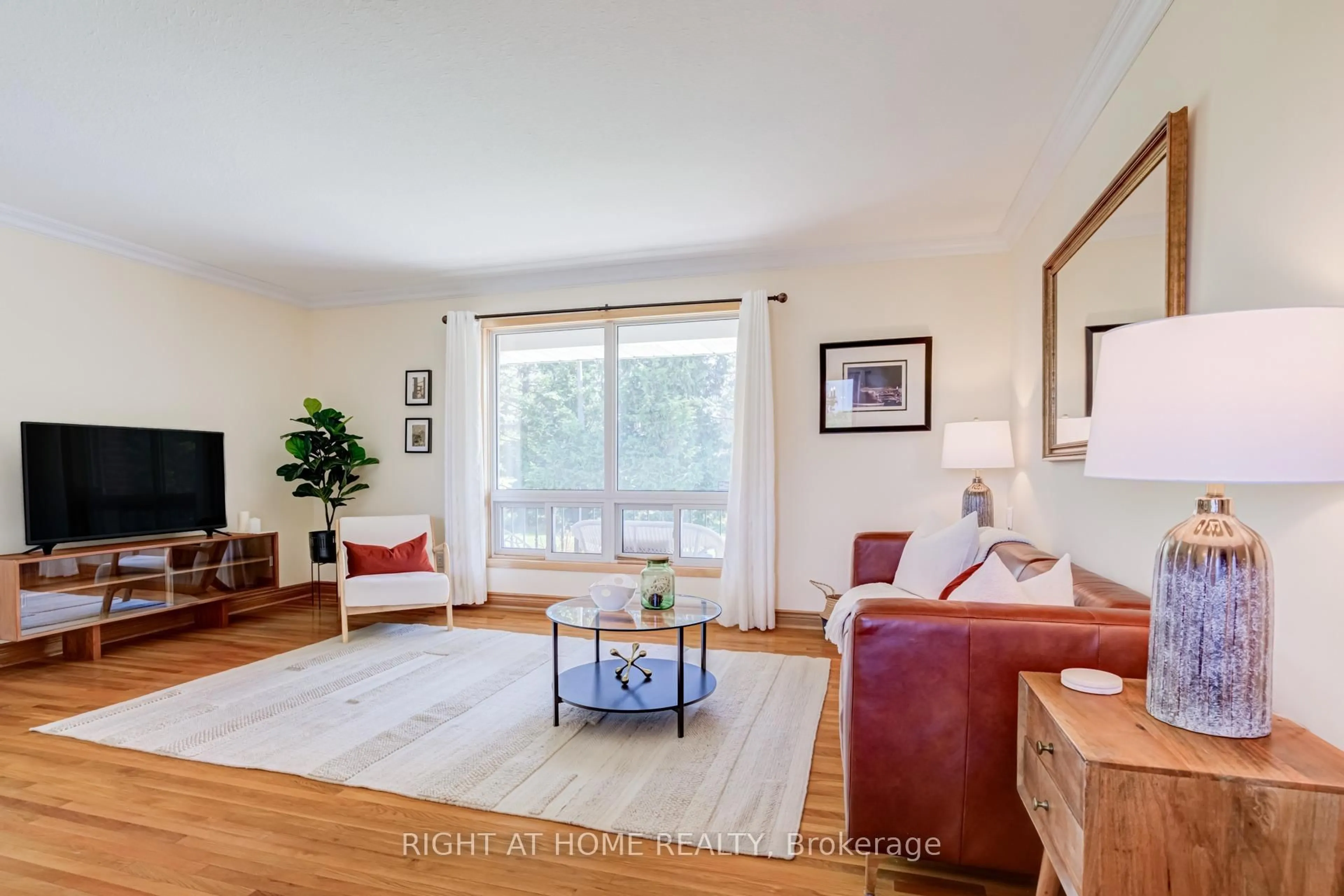 Living room with furniture, wood/laminate floor for 24 Joseph St, Adjala-Tosorontio Ontario L0G 1L0