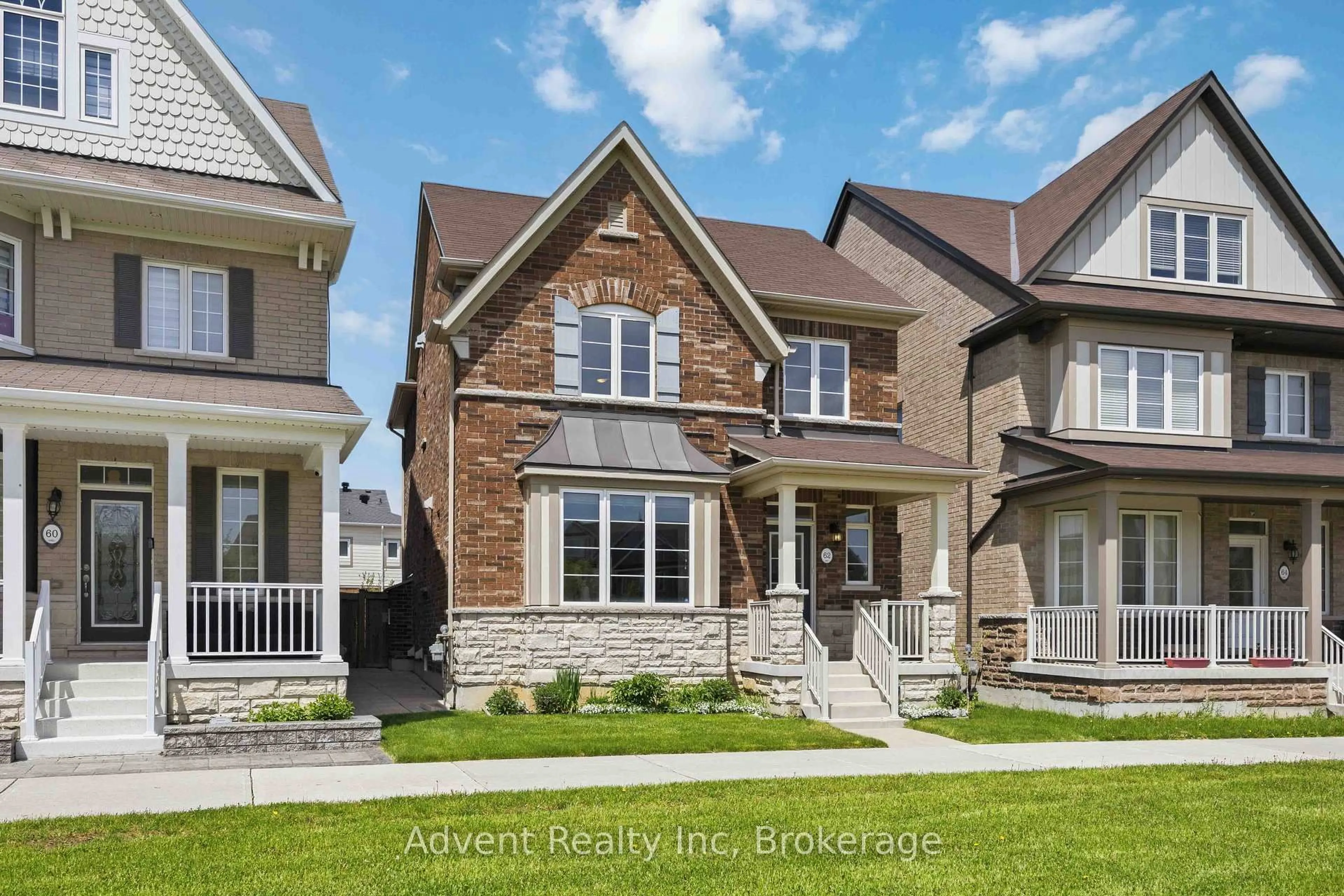 Home with brick exterior material, street for 62 Demott Ave, Markham Ontario L6B 0Z1