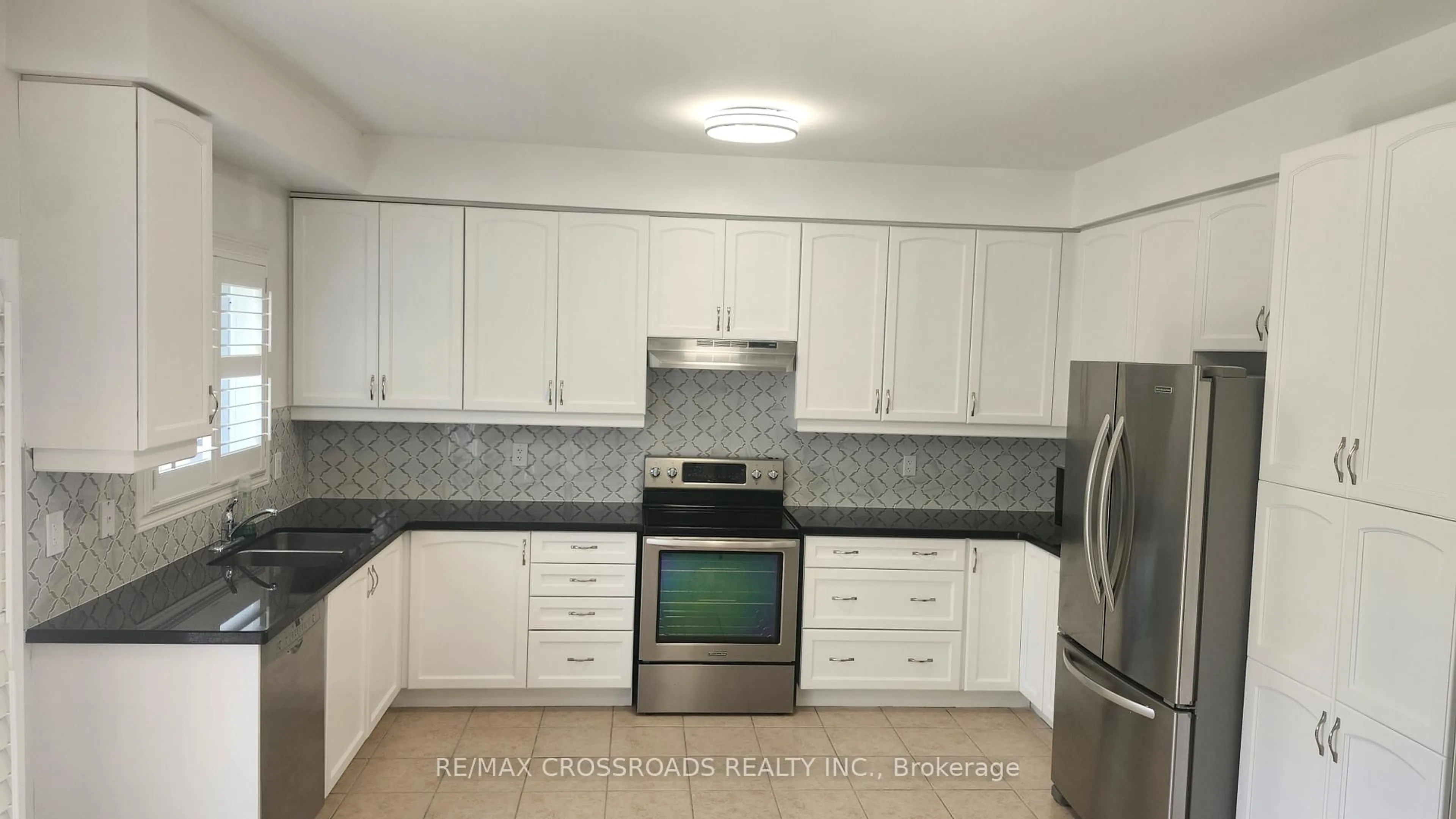 Standard kitchen, ceramic/tile floor for 73 Eakin Mill Rd, Markham Ontario L6E 1N9