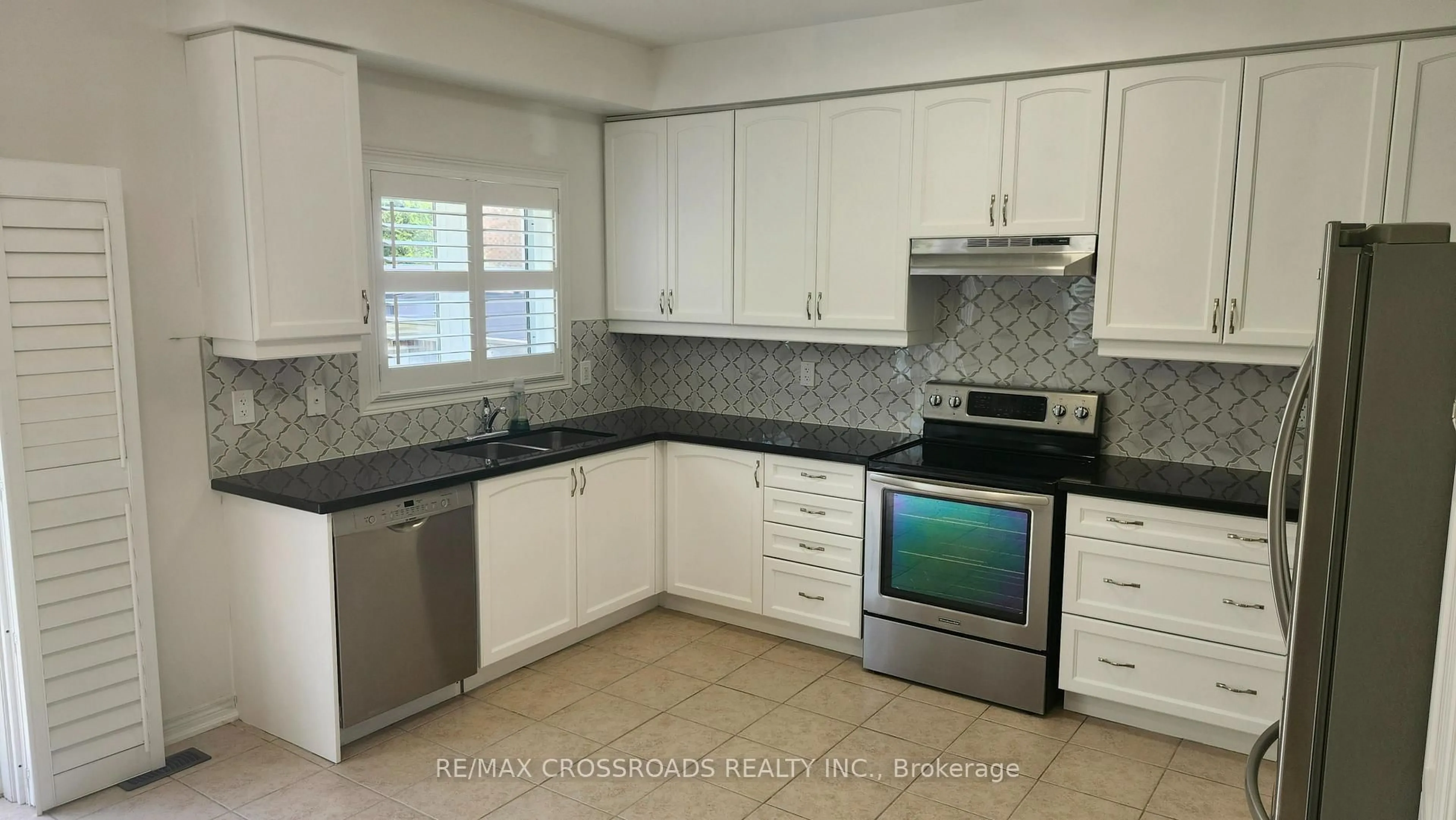 Standard kitchen, ceramic/tile floor for 73 Eakin Mill Rd, Markham Ontario L6E 1N9