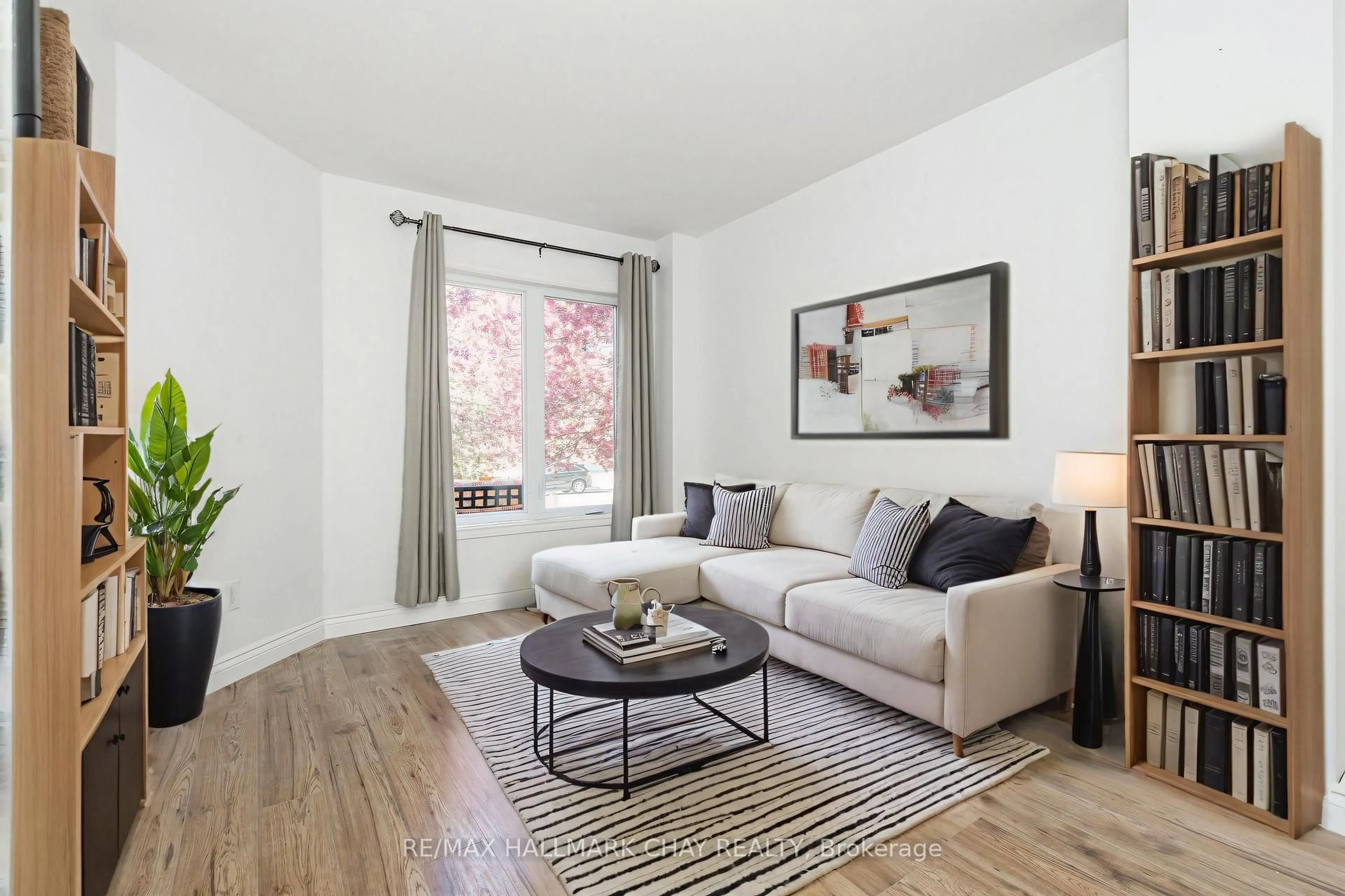 Living room with furniture, wood/laminate floor for 1176 Hill St, Innisfil Ontario L9S 1Y1