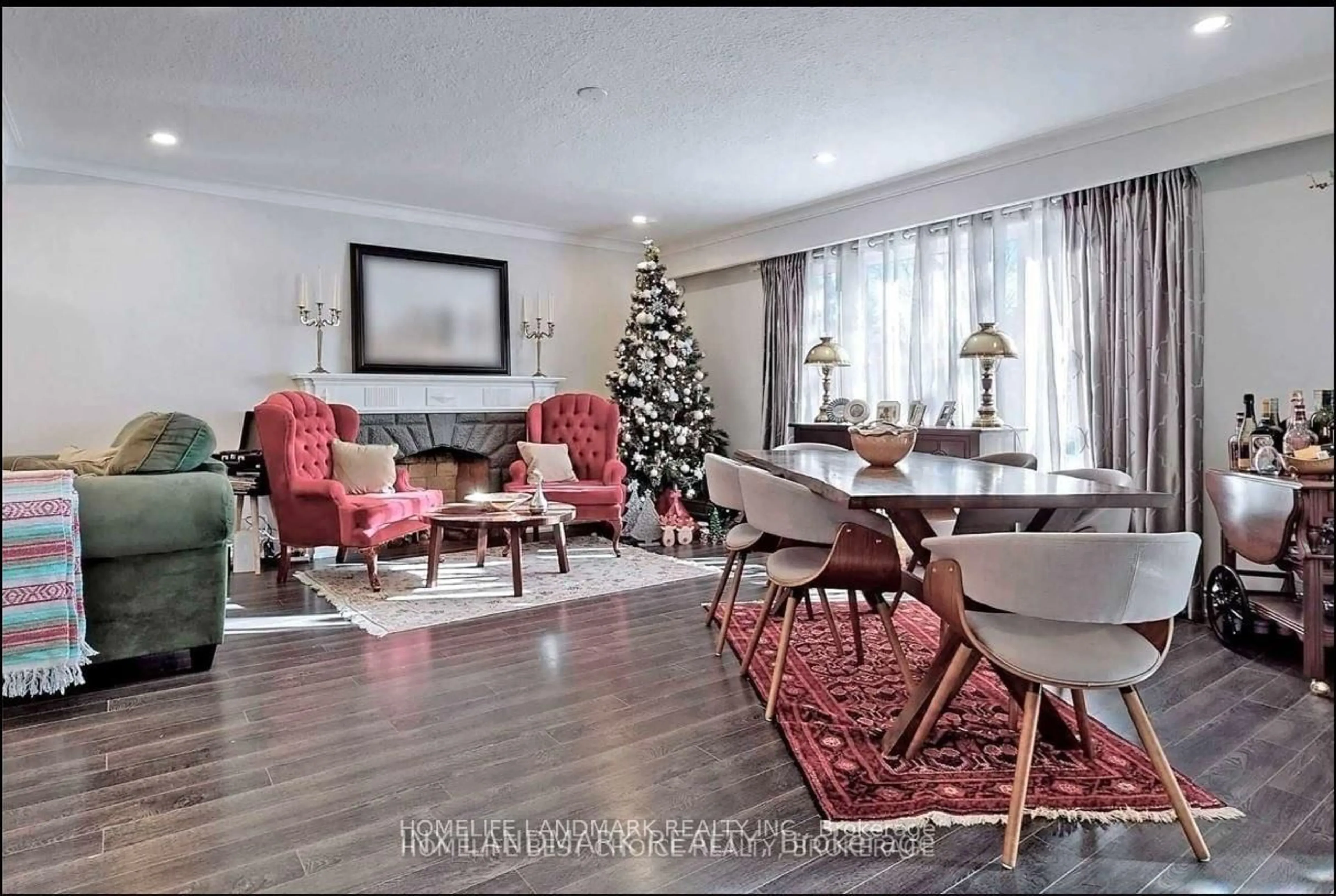 Living room with furniture, wood/laminate floor for 32 Kirk Dr, Markham Ontario L3T 3L1