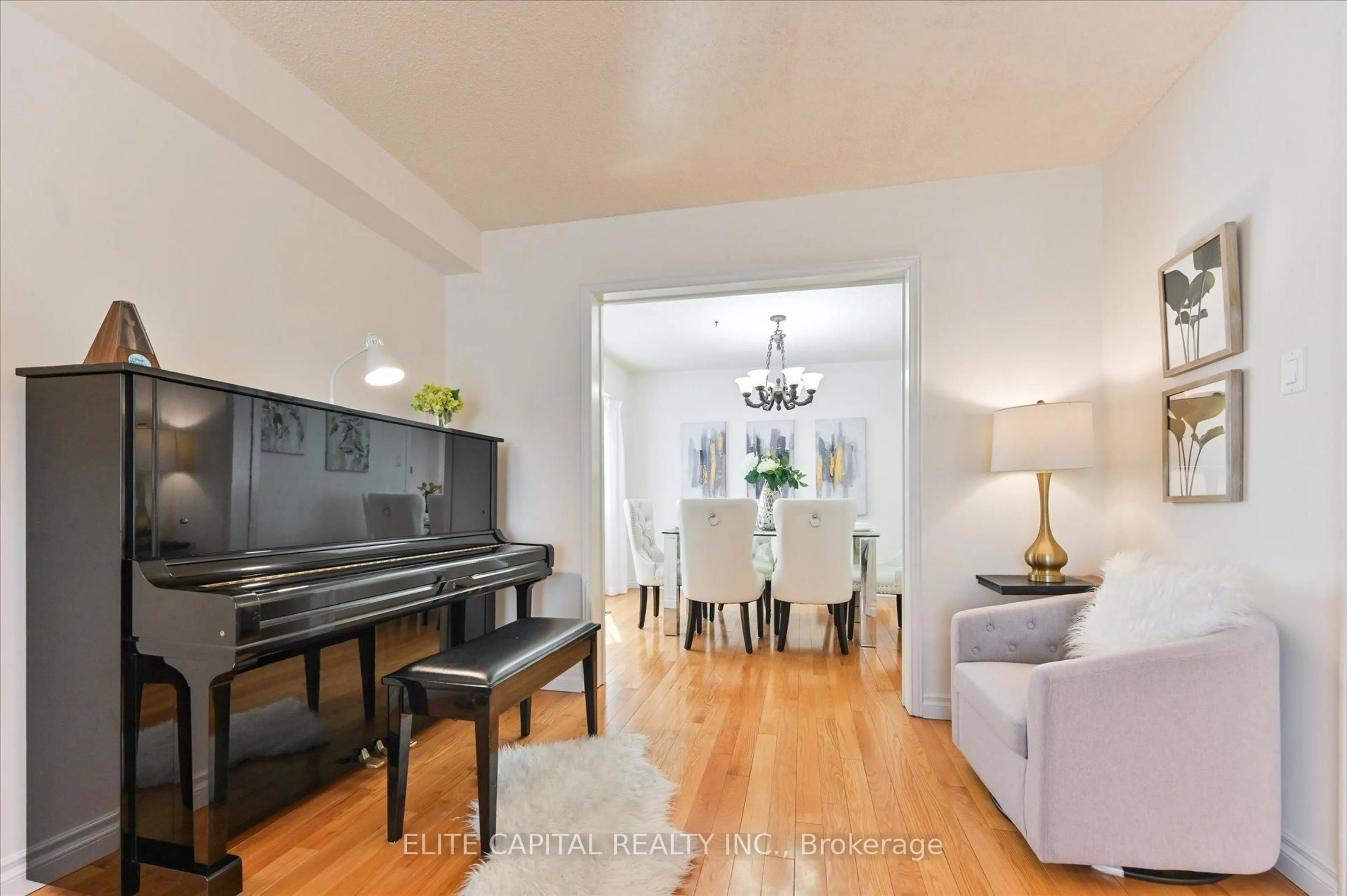 Living room with furniture, wood/laminate floor for 54 Bauer Cres, Markham Ontario L3R 4H4