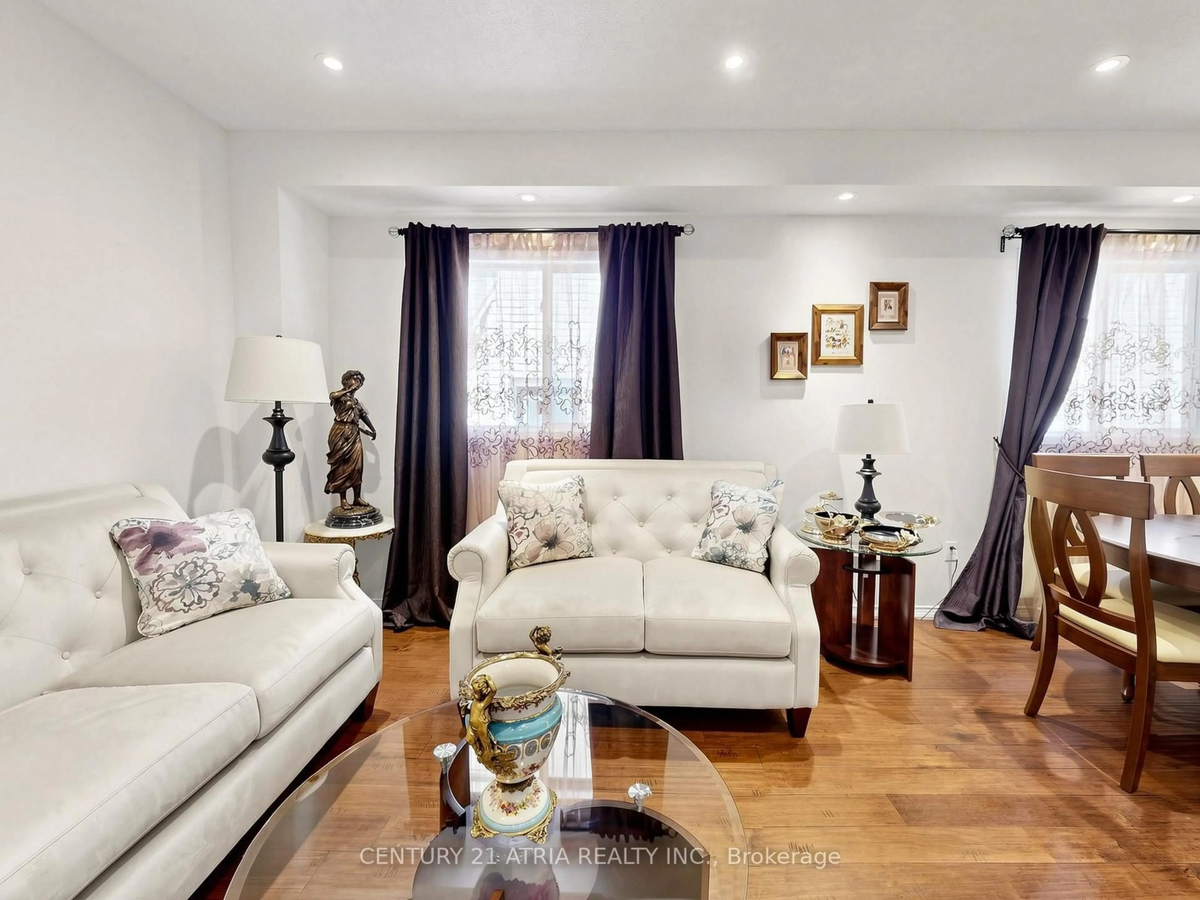 Living room with furniture, wood/laminate floor for 122 Fadine Rd, Newmarket Ontario L3X 2P2