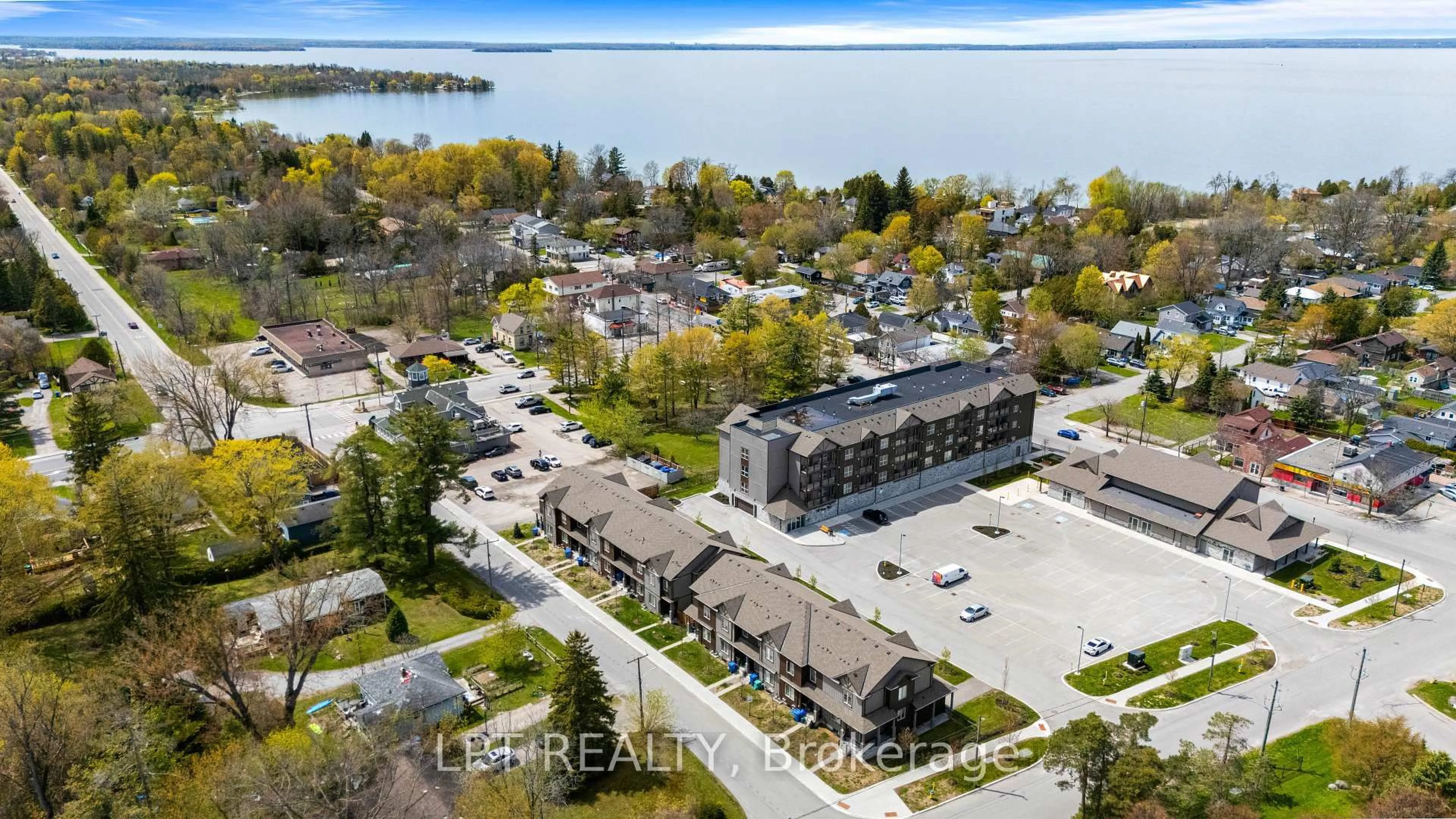 A pic from outside/outdoor area/front of a property/back of a property/a pic from drone, water/lake/river/ocean view for 110 Grew Blvd #TH05, Georgina Ontario L0E 1L0